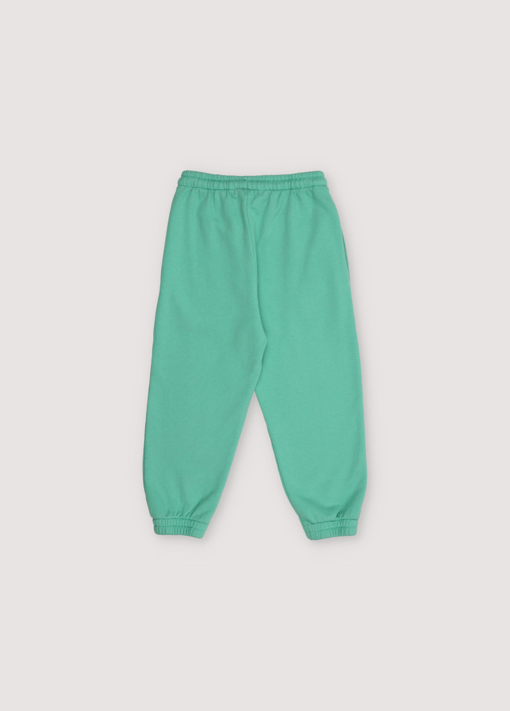 Jogging pants with side pockets, elastic waistband and cuffs, featuring a contrast logo print. Spring Summer Collection. The New Society. 