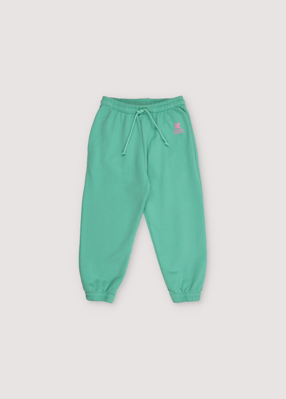 Jogging pants with side pockets, elastic waistband and cuffs, featuring a contrast logo print. Spring Summer Collection. The New Society. 