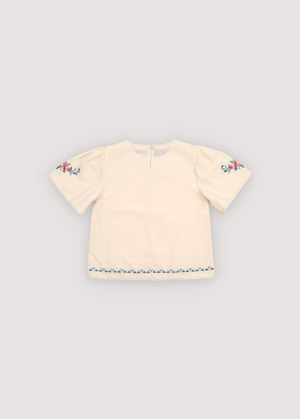 Blouse in soft cotton featuring beautiful fine embroidery details on the front and sleeves, adding a delicate and refined touch