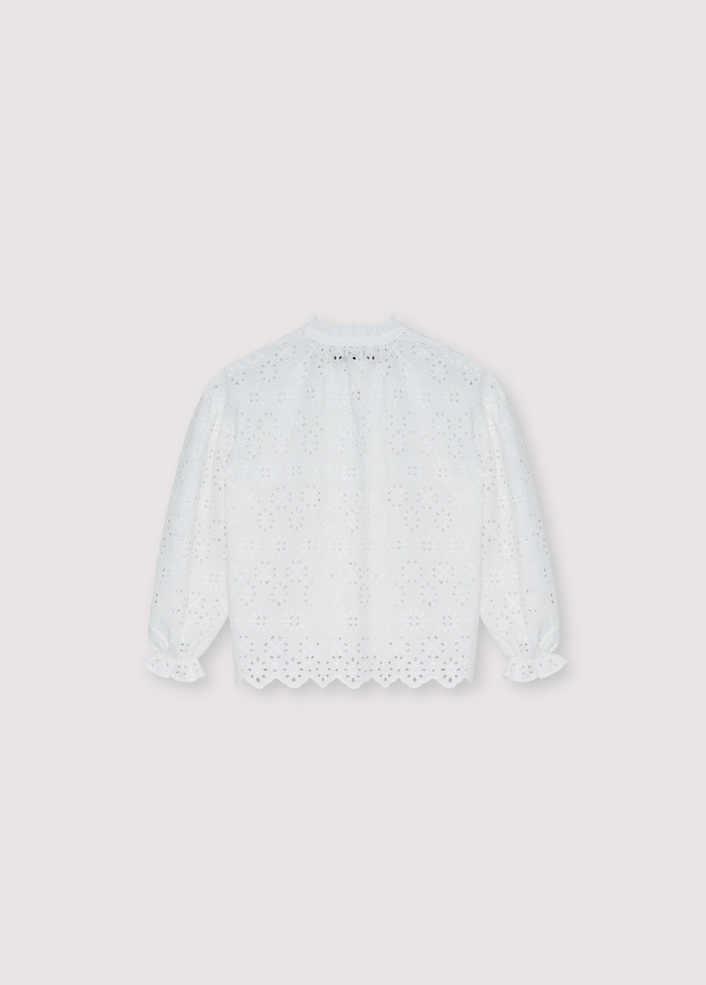 Teen blouse crafted from a beautiful embroidered cotton fabric.