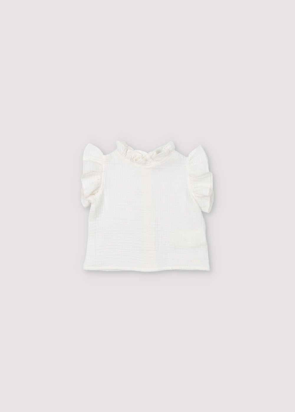 Spyros Baby Blouse in 100% cotton muslin fabric in our coconut color. TNS Kids embroidery to match. Spring Summer Collection. The New Society. 