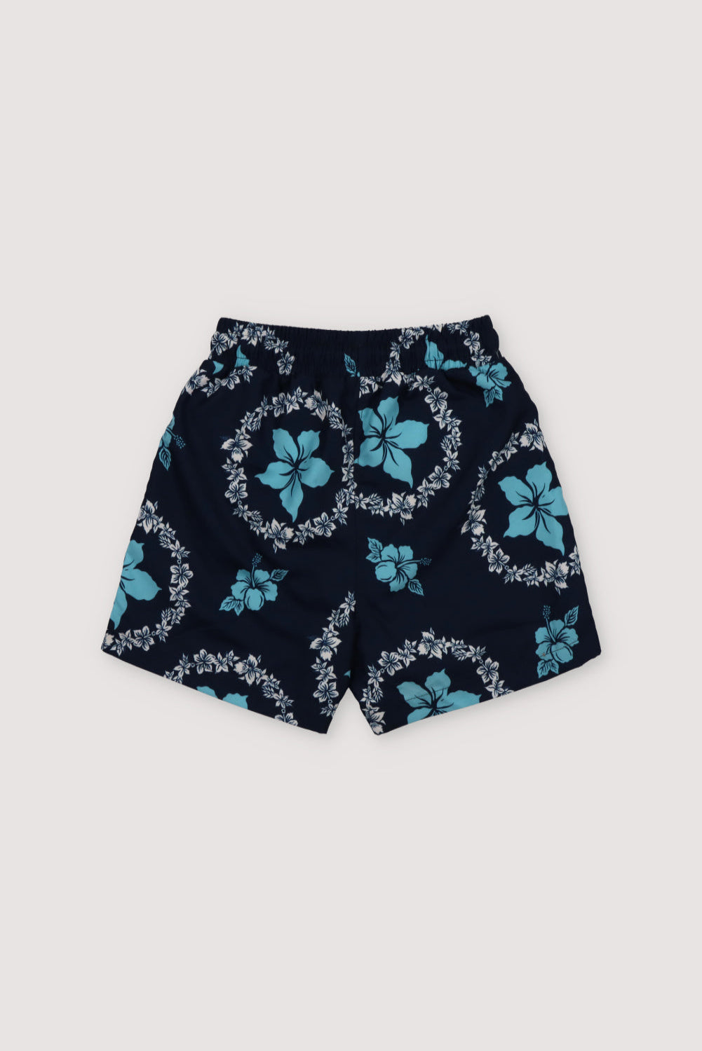 Swimsuit with two-color floral print on a navy background, featuring an elastic waistband with an adjustable drawstring. Spring Summer Collection. The New Society.