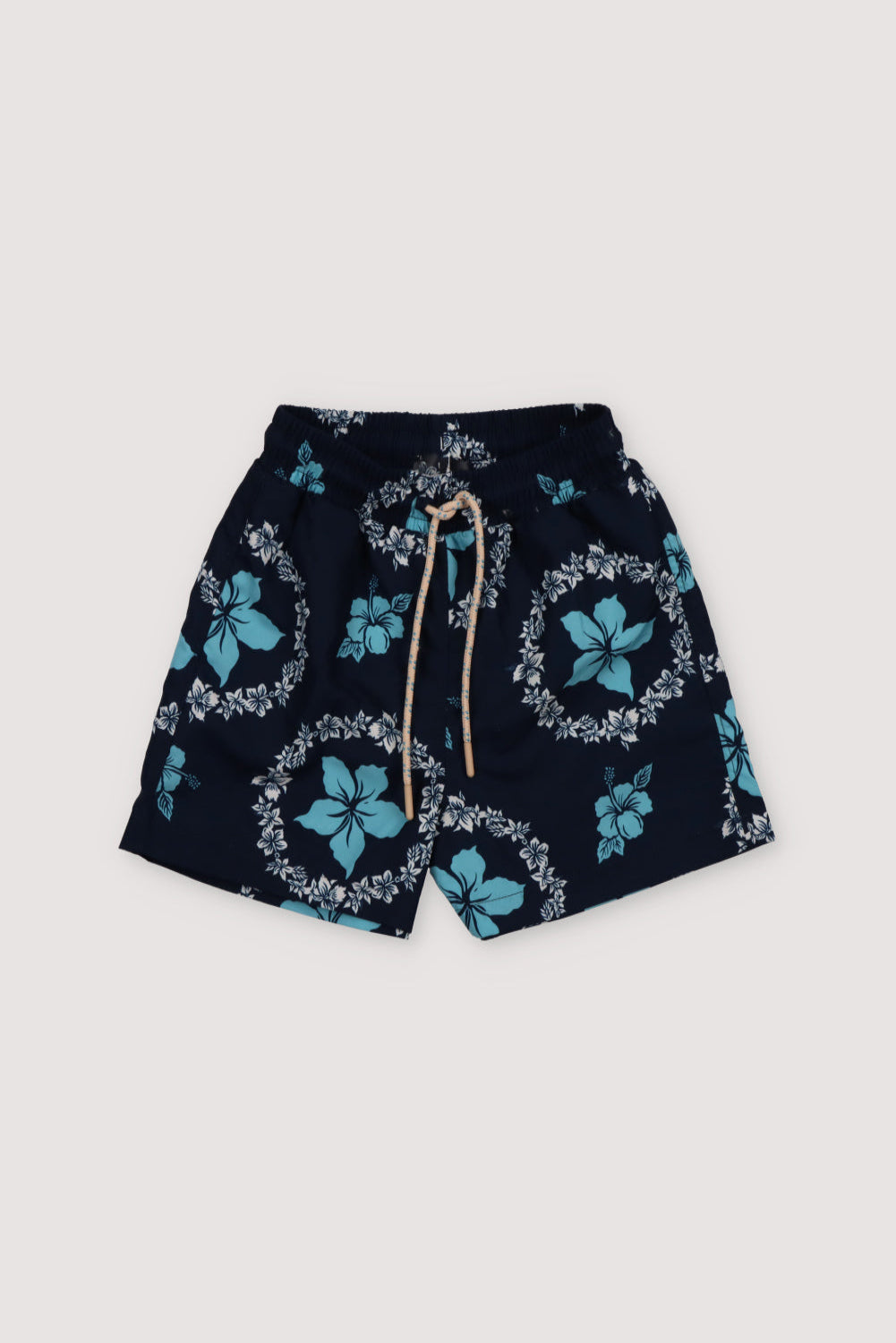 Swimsuit with two-color floral print on a navy background, featuring an elastic waistband with an adjustable drawstring. Spring Summer Collection. The New Society.