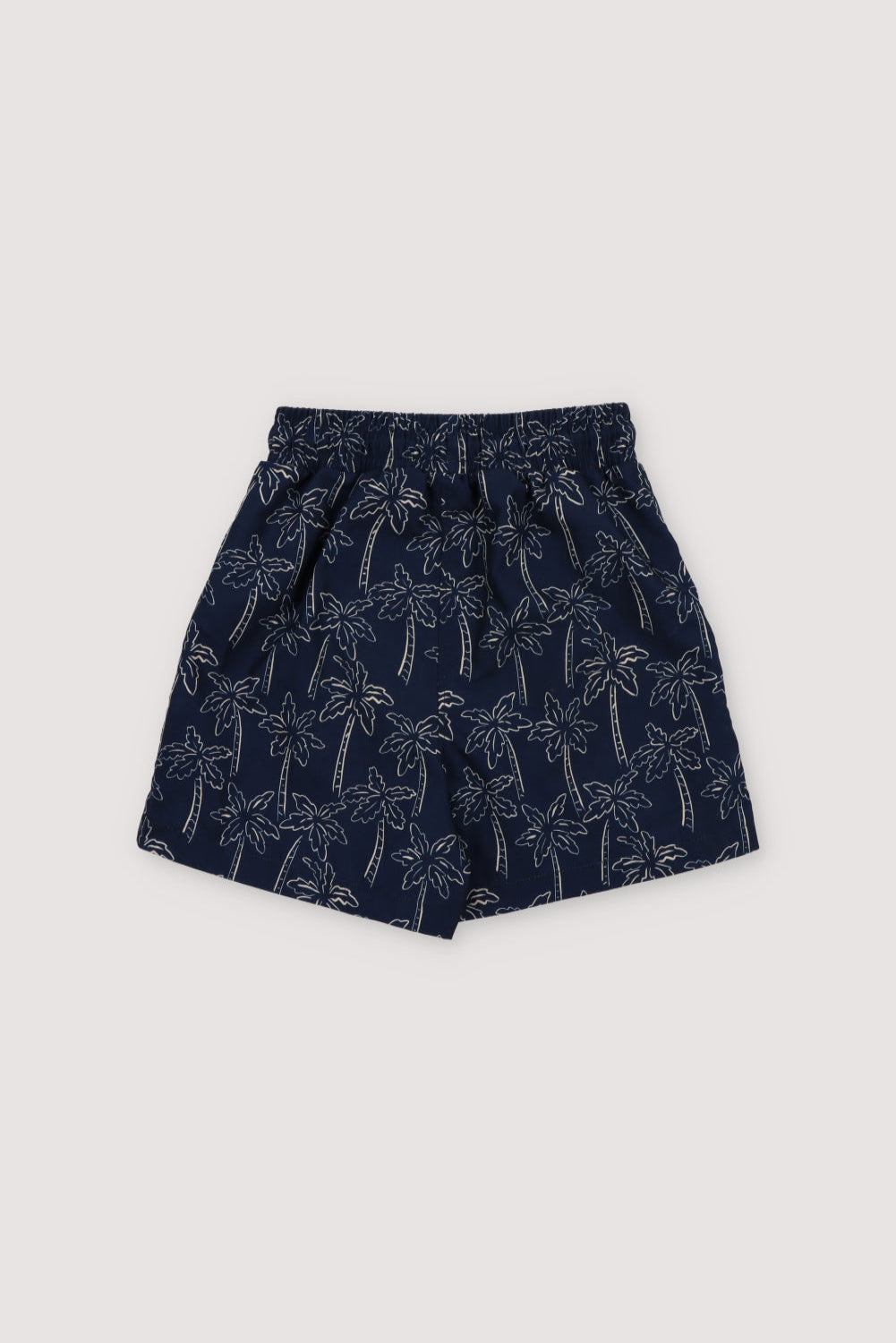 Swimsuit with contrast palm tree print on a navy background, featuring an elastic waistband with an adjustable drawstring. Spring Summer Collection.  The New Society.