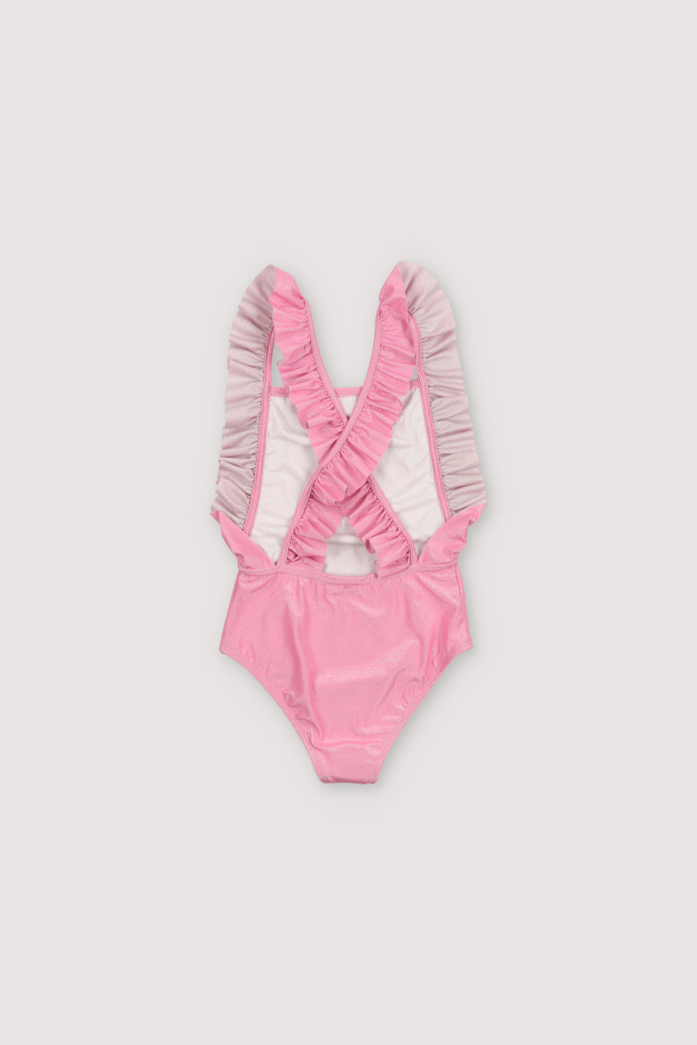 Swimsuit made of glitter fabric. It features ruffle detailing on the sides and straps and crisscross straps at the back. Spring Summer Collection. The New Society. 