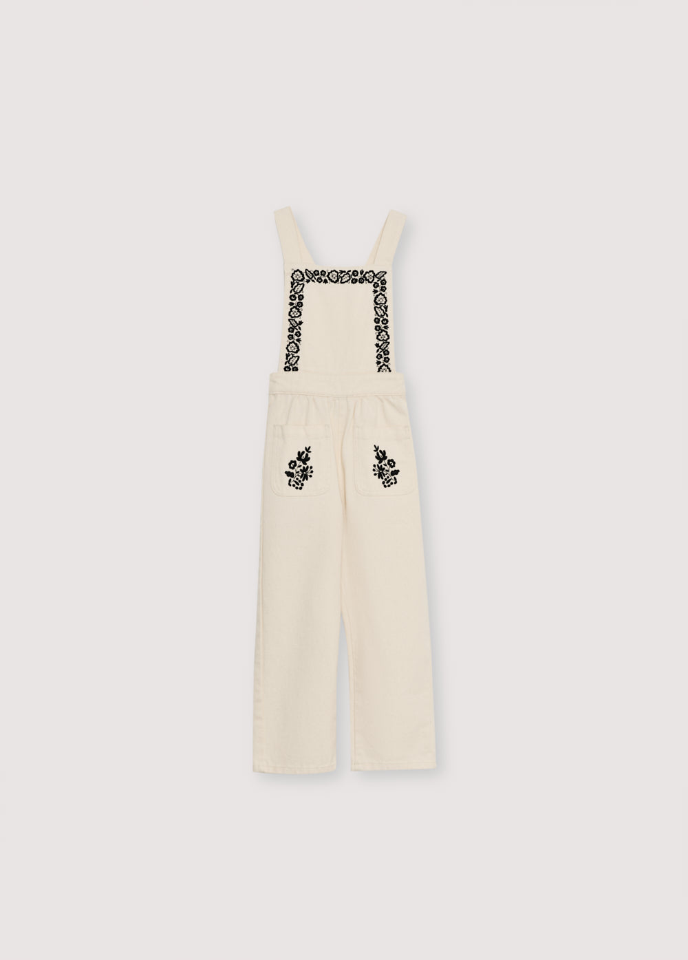 Denim overall with contrast embroidery details on the upper front and two patch pockets in the front. It features an elastic waistband at the back and adjustable straps at the back.