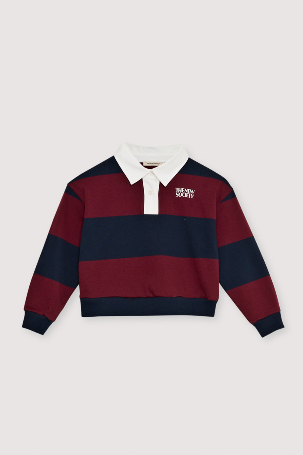 Bicolor striped crop polo with a contrasting collar in twill fabric. It features a contrasting print on the chest.