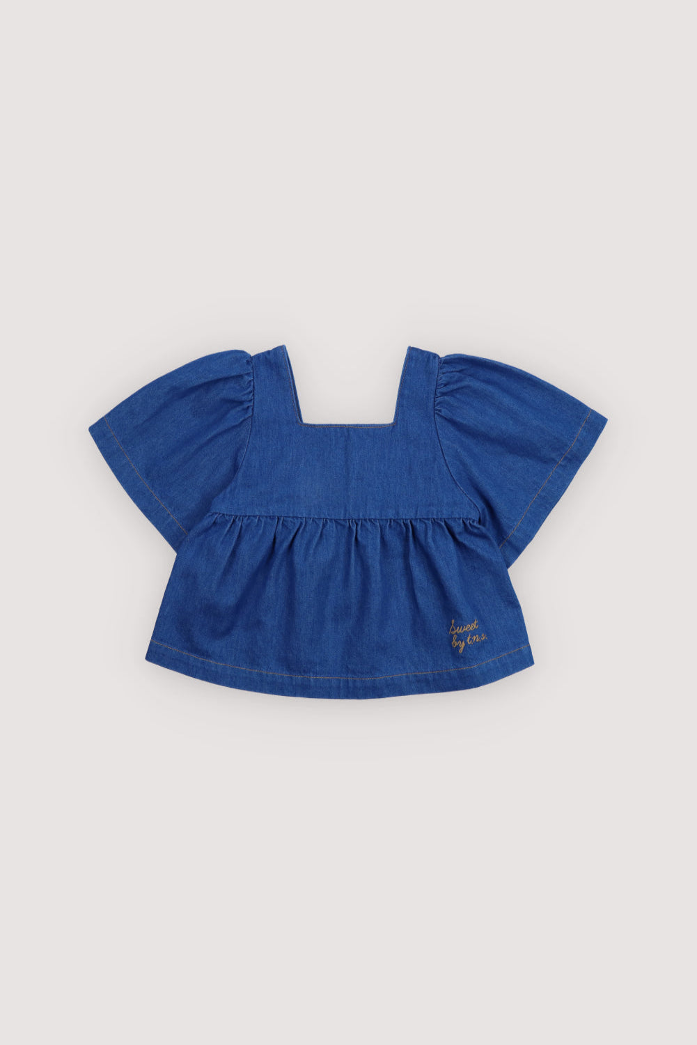 Cotton denim blouse with a square neckline and chest seam detail, featuring short puff sleeves that add volume and charm.