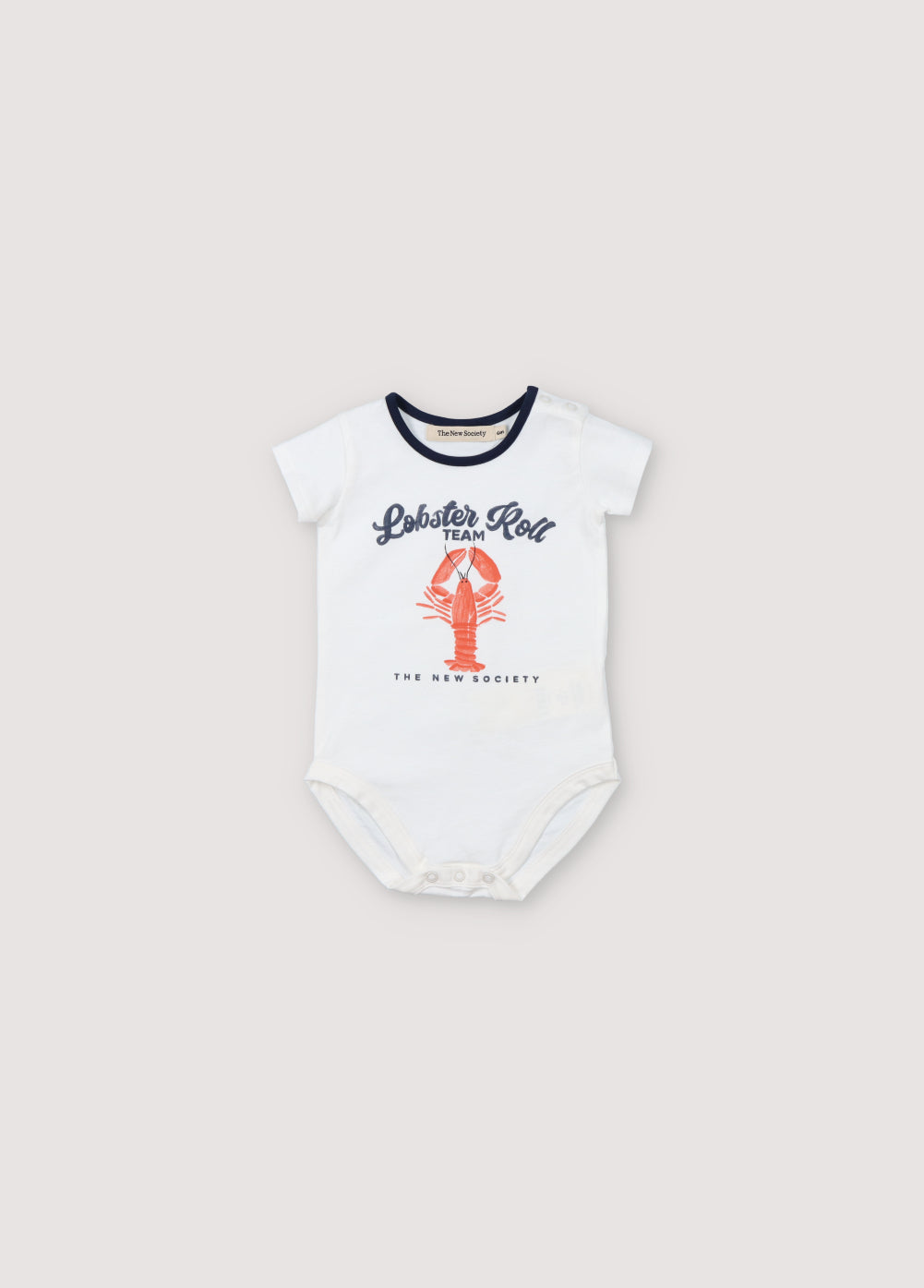 Short-sleeved baby romper with tone-on-tone snap opening at the shoulder and bottom. It features a playful lobster print on the front and contrast details on the sleeves and neckline. Spring Summer Collection. The New Society. 