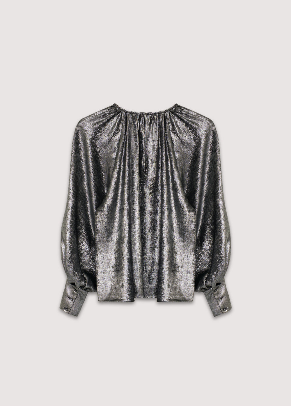 Silver shine blouse with a round neckline and gathered detailing, puffed sleeves with wide cuffs, and covered buttons in the same fabric. It features a back opening with a keyhole and button closure.