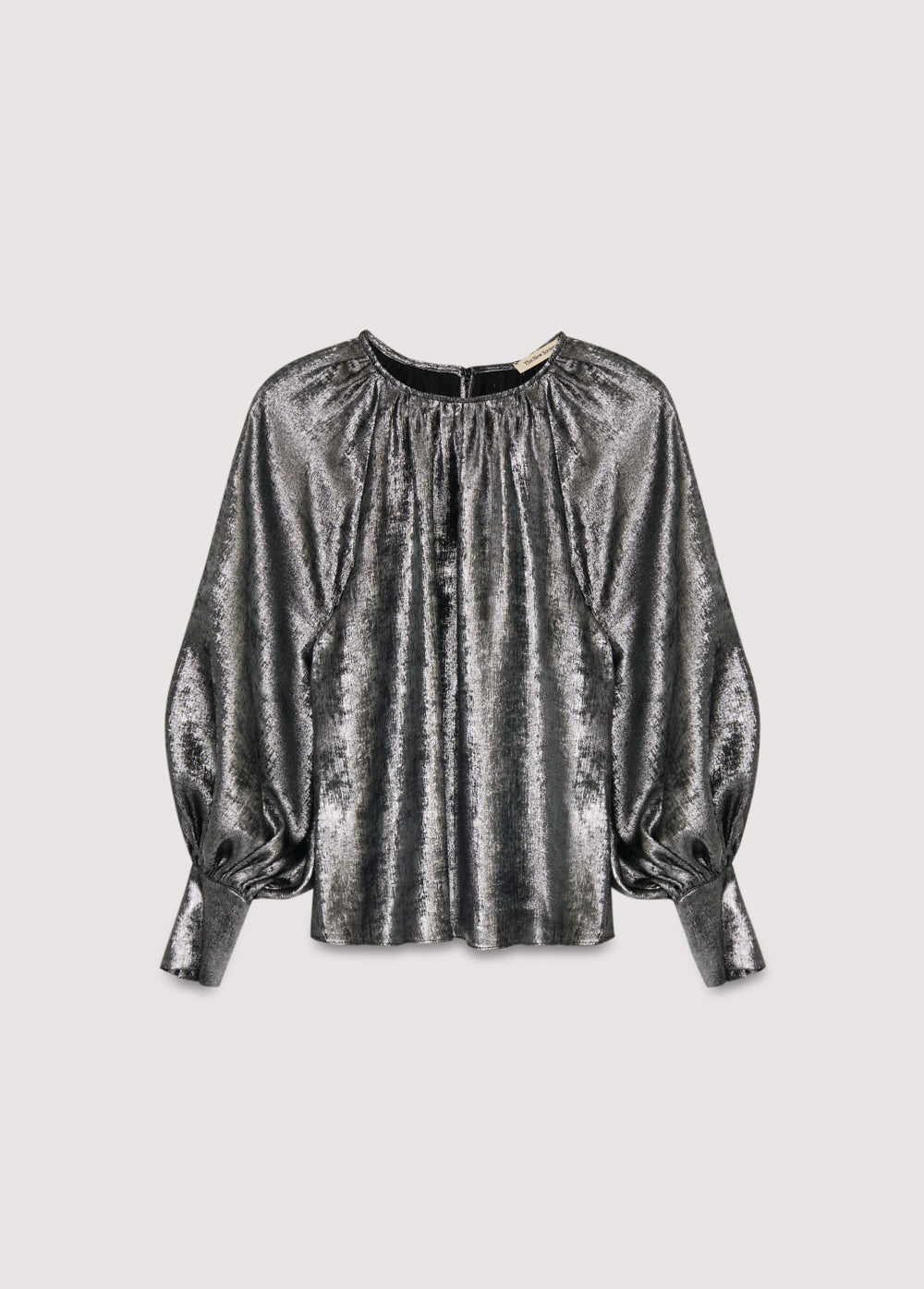 Silver shine blouse with a round neckline and gathered detailing, puffed sleeves with wide cuffs, and covered buttons in the same fabric. It features a back opening with a keyhole and button closure.
