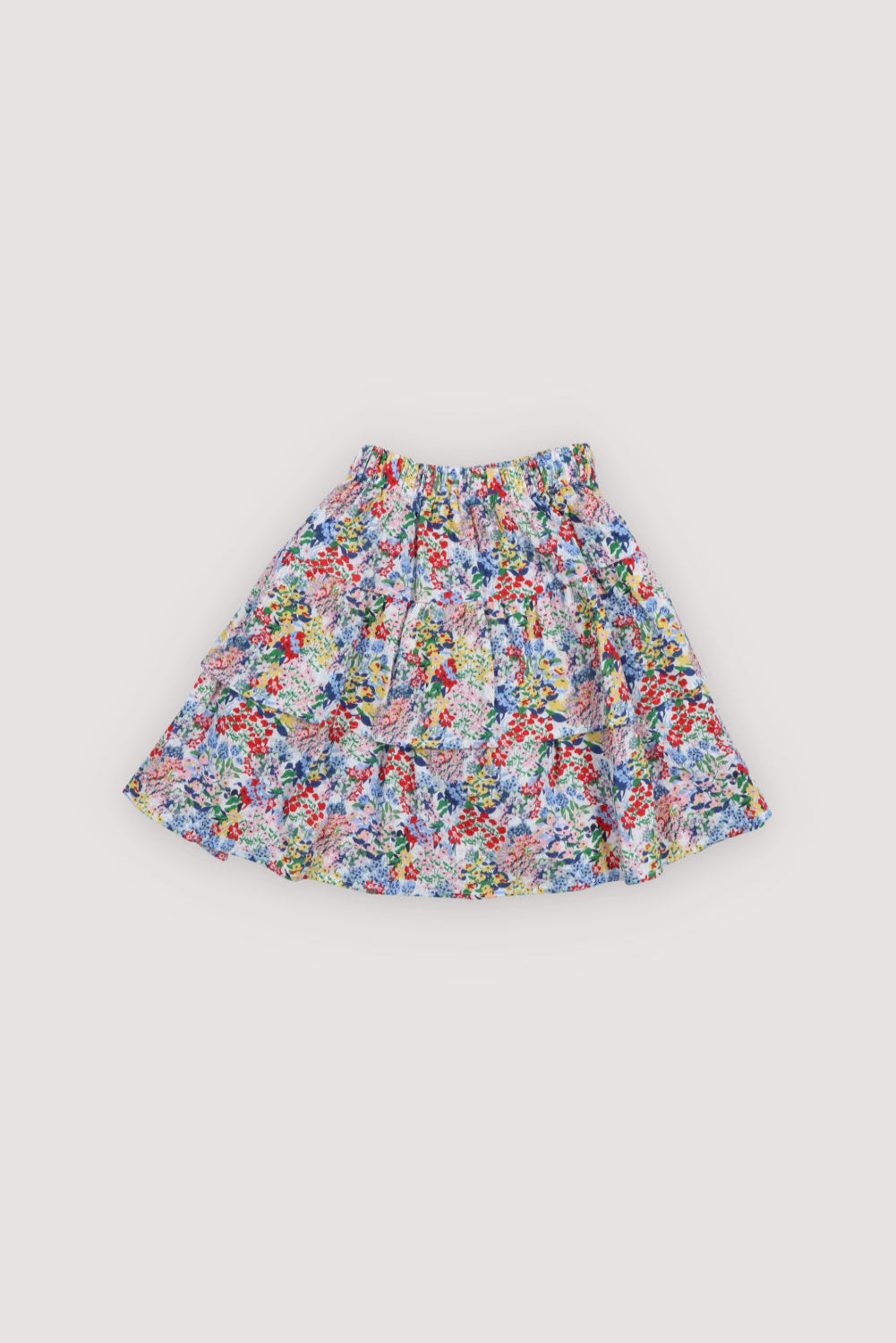 Seersucker cotton skirt featuring a floral print, double ruffle detail, and elastic waistband for a comfortable fit.