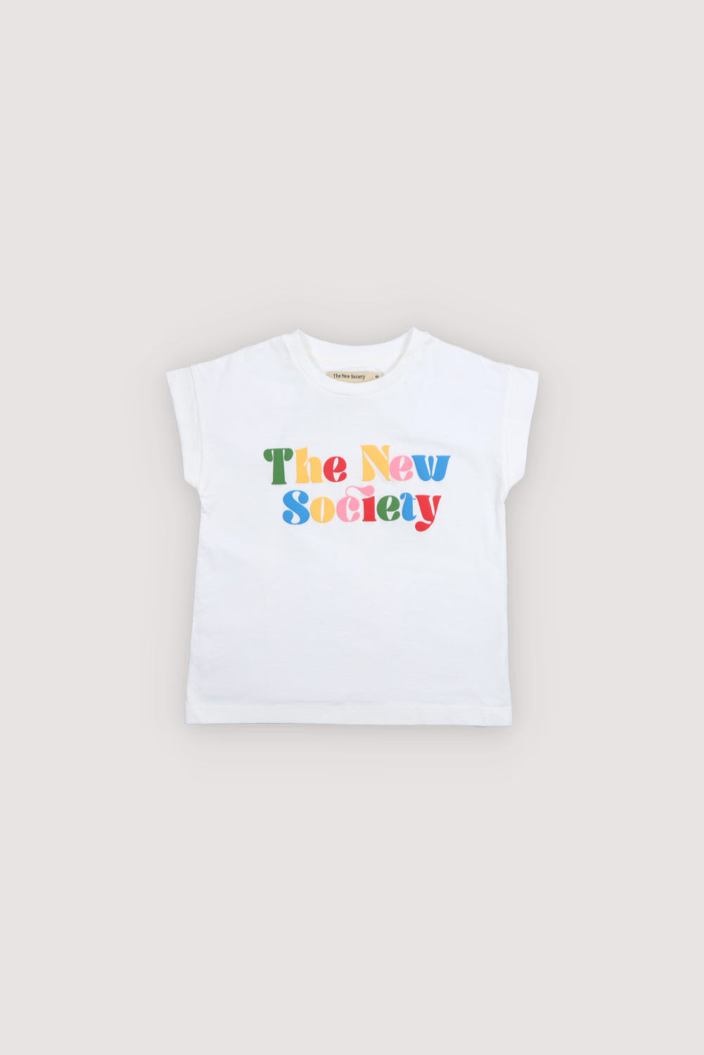 Stand out with the White T-Shirt from our Teen Drop 1 SS26 collection. Made from soft, sustainable fabric, this tee features colorful ‘The New Society’ text on a clean beige background. 