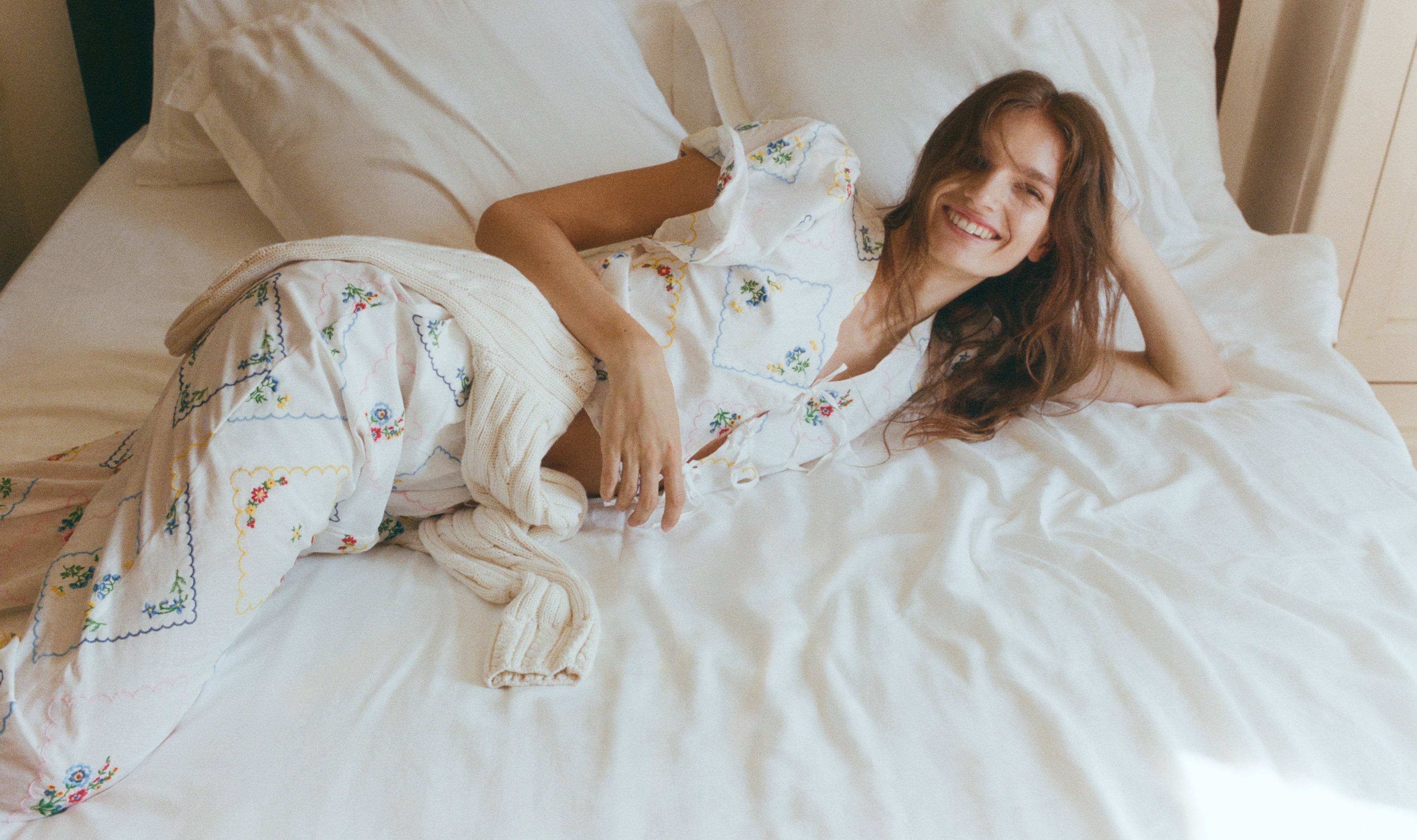 Delicate and charming, this 100% cotton woman blouse, made in Portugal, features exquisite multicolor floral embroidery throughout.