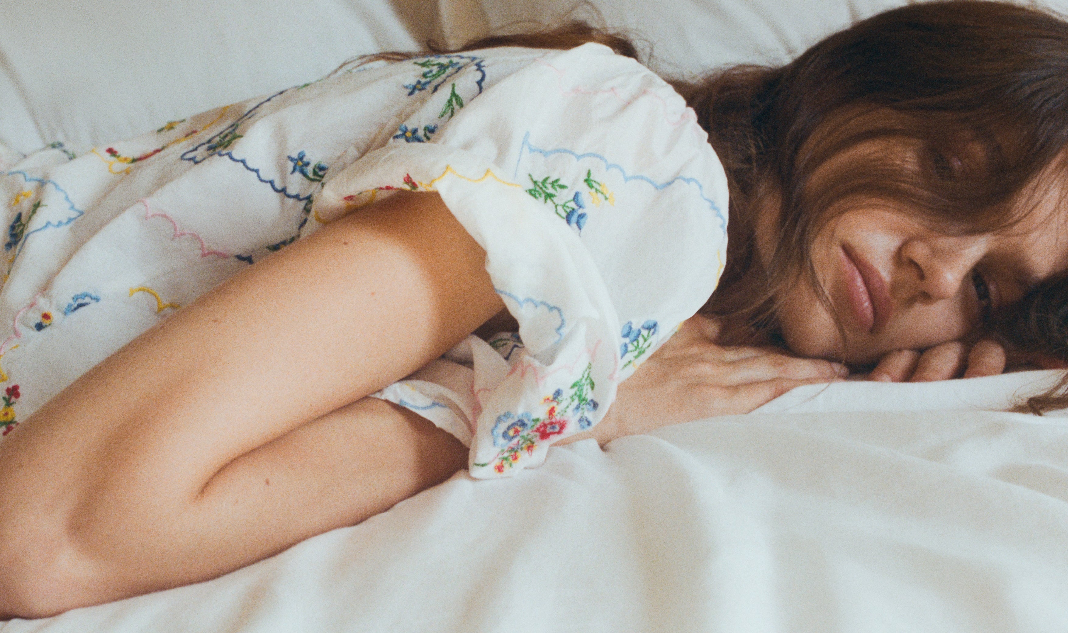 Delicate and charming, this 100% cotton woman blouse, made in Portugal, features exquisite multicolor floral embroidery throughout.