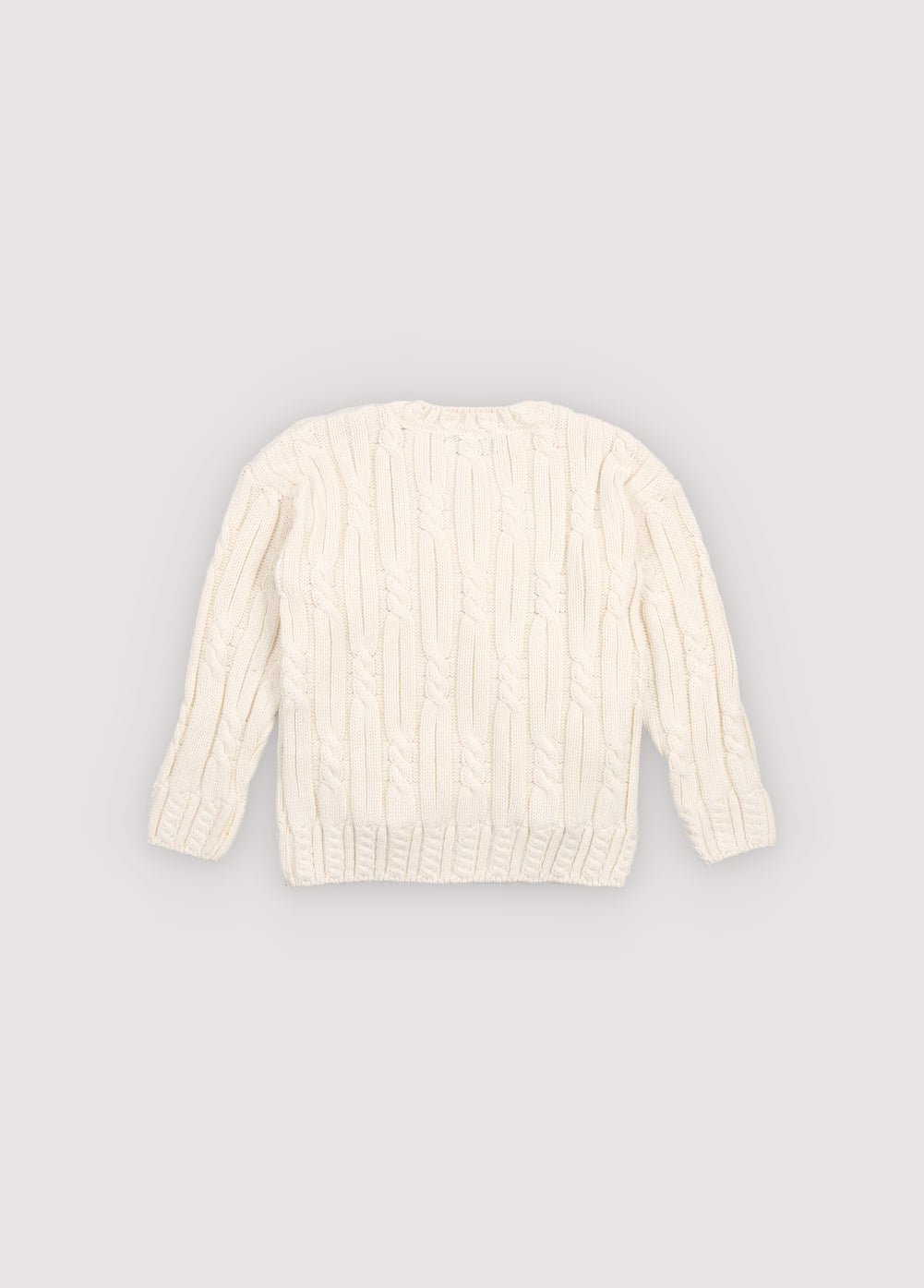 Cable knit sweater with&nbsp;subtle cable details on the collar, cuffs, and hem, featuring a playful floral branded embroidery on the chest.