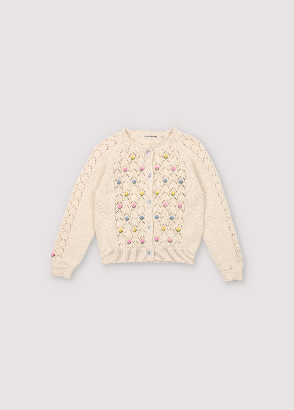 Cardigan with structure and flower details. It has a wooden button opening. Perfect to combine with the marching short and top. 