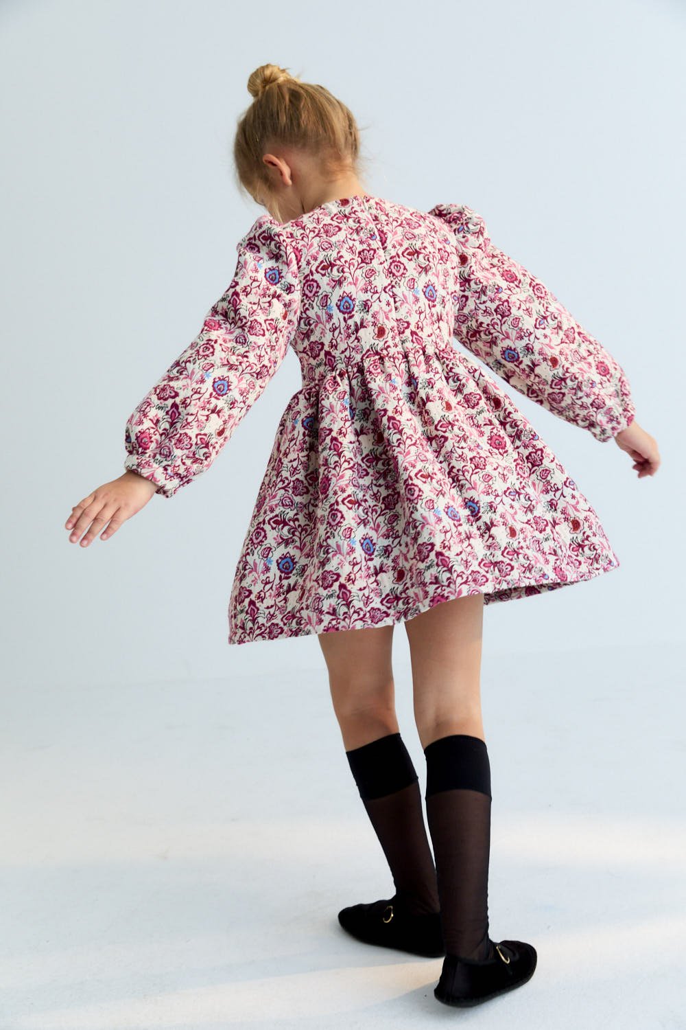 A timeless evening dress crafted in elegant floral jacquard, designed to make an impression. 