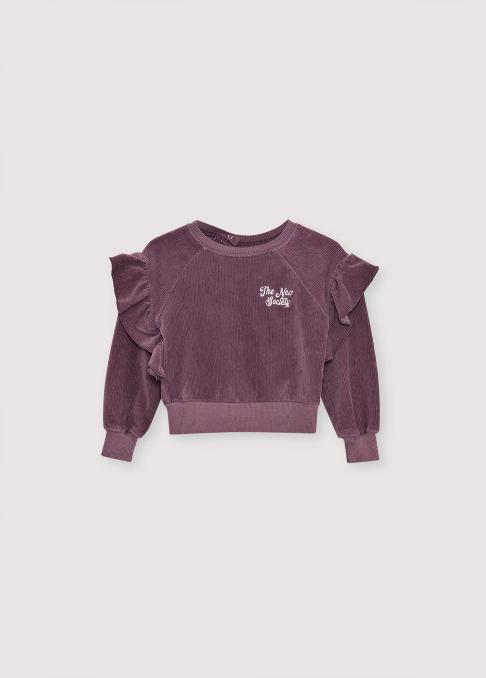 Sweat-shirt en jersey de velours côtelé avec un détail volant unique sur les épaules et une broderie de la marque sur la poitrine. Il a une ouverture à l'épaule avec des boutons-pression. Il est livré avec un pantalon assorti pour compléter le look.