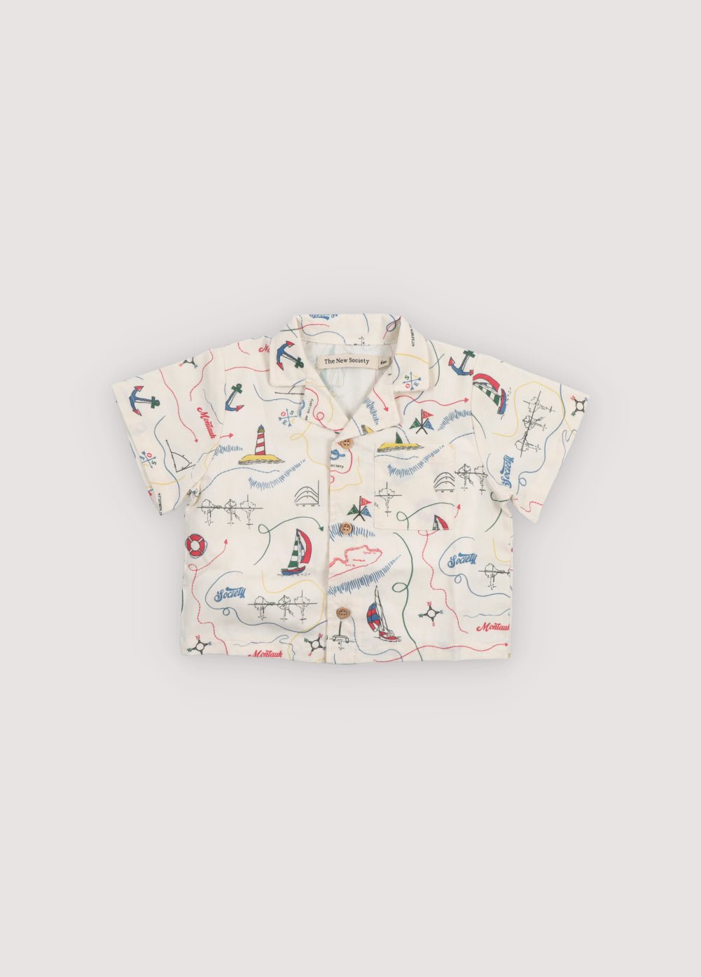 Short sleeve shirt in&nbsp;soft cotton featuring a unique multicolor map print and a front button closure with wooden buttons.
