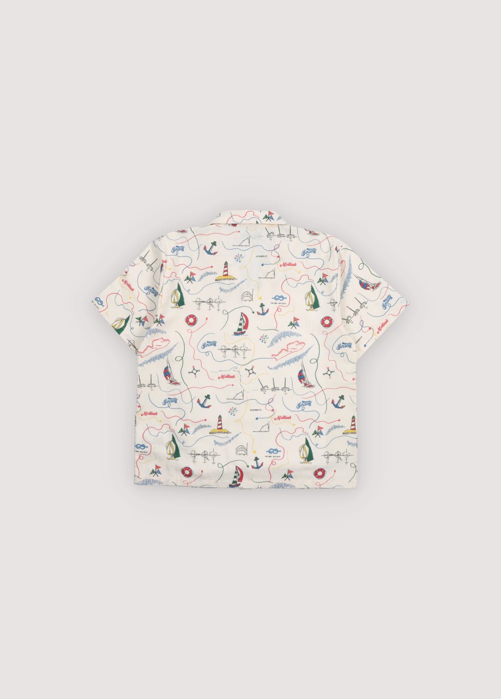 Short sleeve shirt in&nbsp;soft cotton featuring a unique multicolor map print and a front button closure with wooden buttons. 