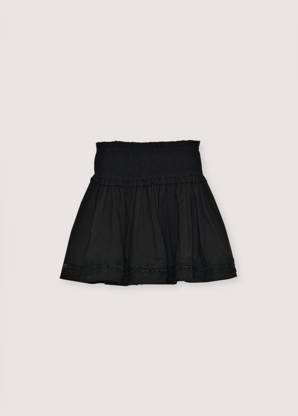 Falda de gasa de algodón con detalle fruncido en la parte superior y bajo con volante y ribete de encaje. Perfecto para combinar con la blusa a juego. 