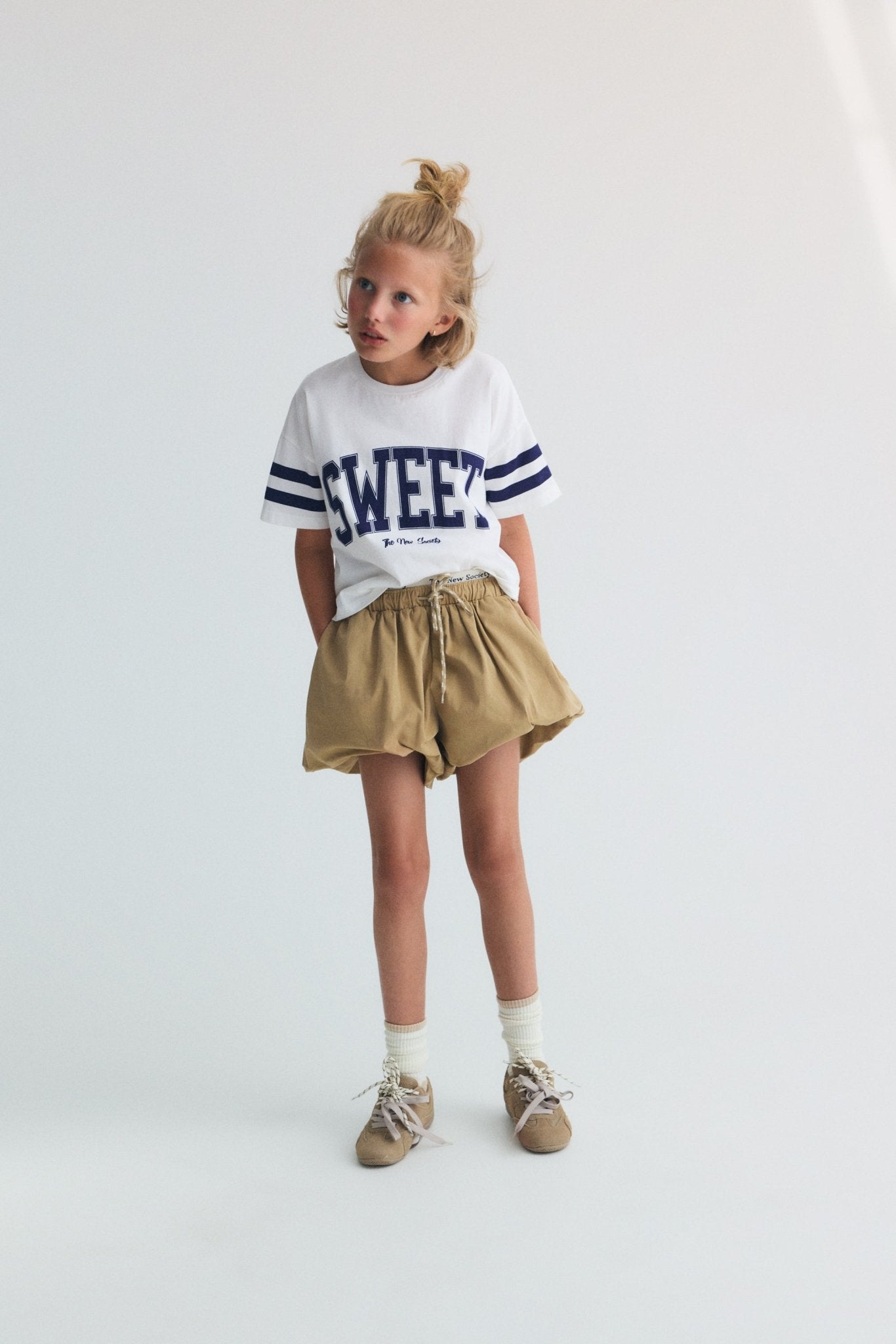 Soft and lightweight cotton jersey crop tee featuring contrast prints on the sleeves and a “Sweet” print on the front for a playful, contemporary look.