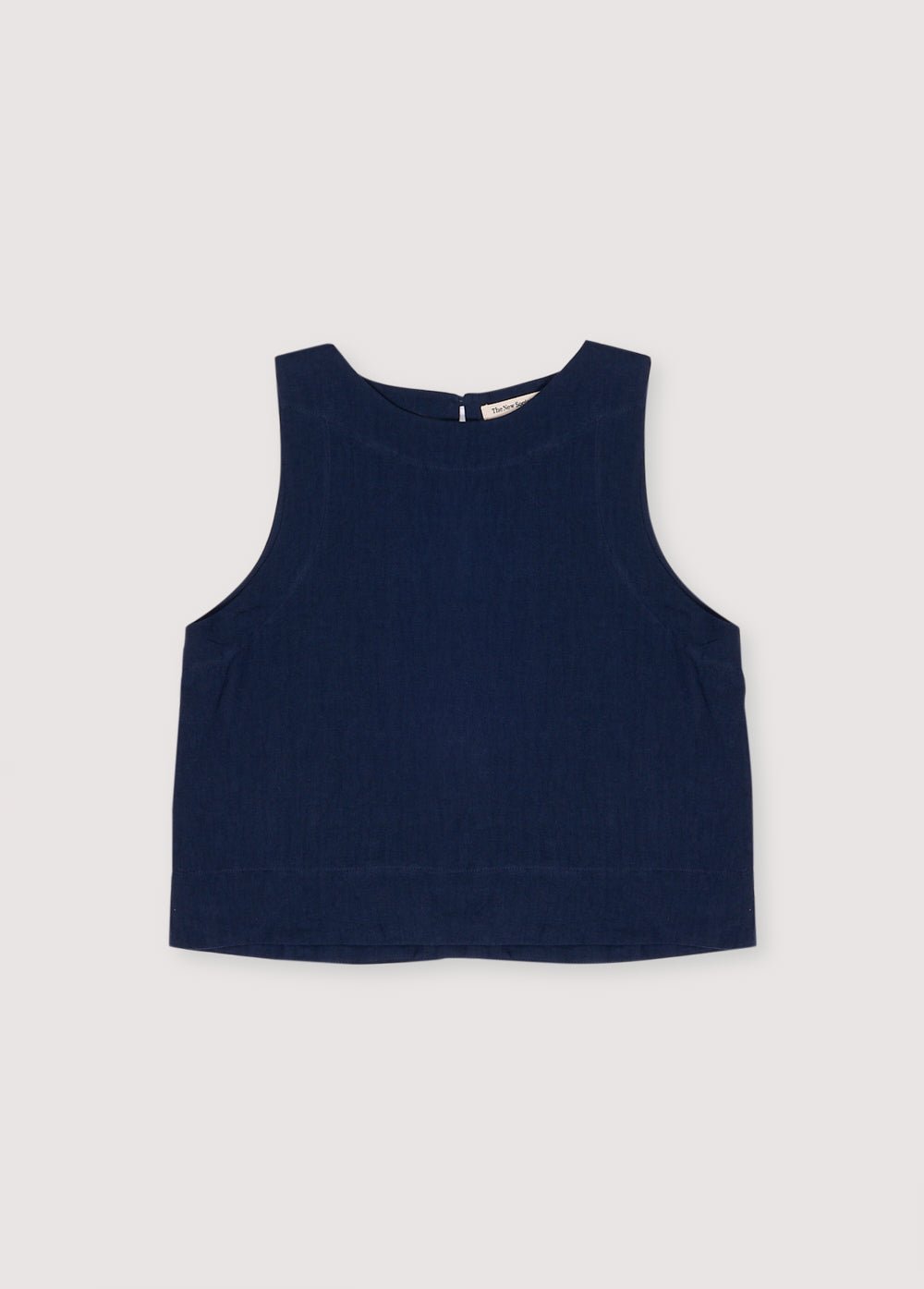 Hera Woman Top in 100% linen, available in three colors: Navy, Hibiscus, Palm, with wide straps and a bottom cut. Perfect for the total look with the palazzo pant. Spring Summer Collection. The New Society