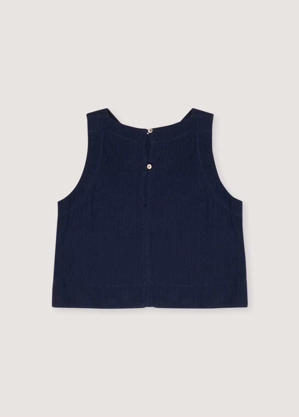 Hera Woman Top in 100% linen, available in three colors: Navy, Hibiscus, Palm, with wide straps and a bottom cut. Perfect for the total look with the palazzo pant. Spring Summer Collection. The New Society