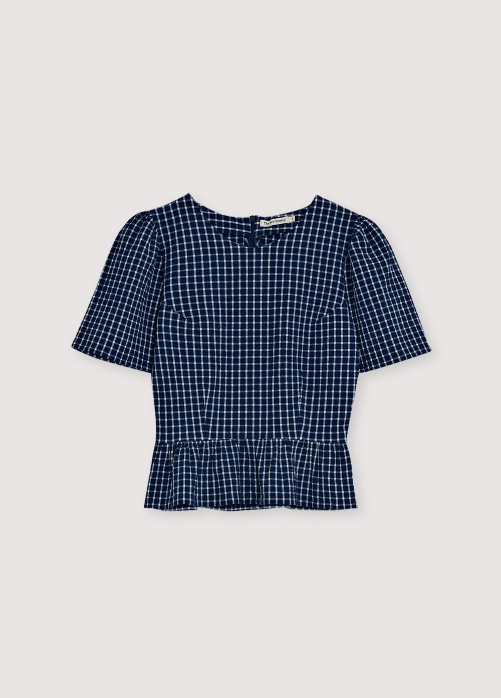 Crafted from soft cotton seersucker, this blouse features a charming gingham check, cut-and-ruffle details, and voluminous gathered sleeves