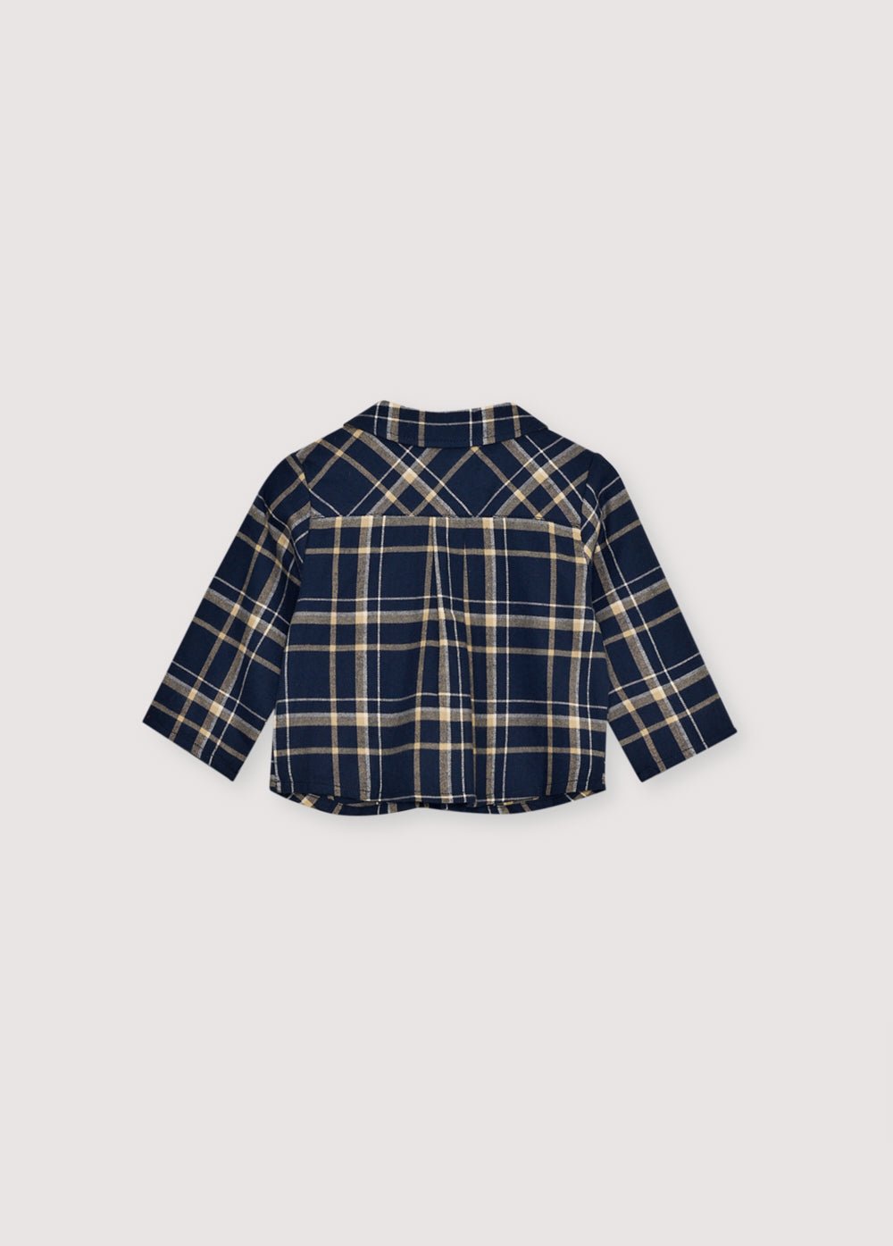 Chemise en flanelle à carreaux avec boutons en bois et logo TNS brodé sur la poitrine. Il est accompagné d'un pantalon assorti pour créer un look complet.