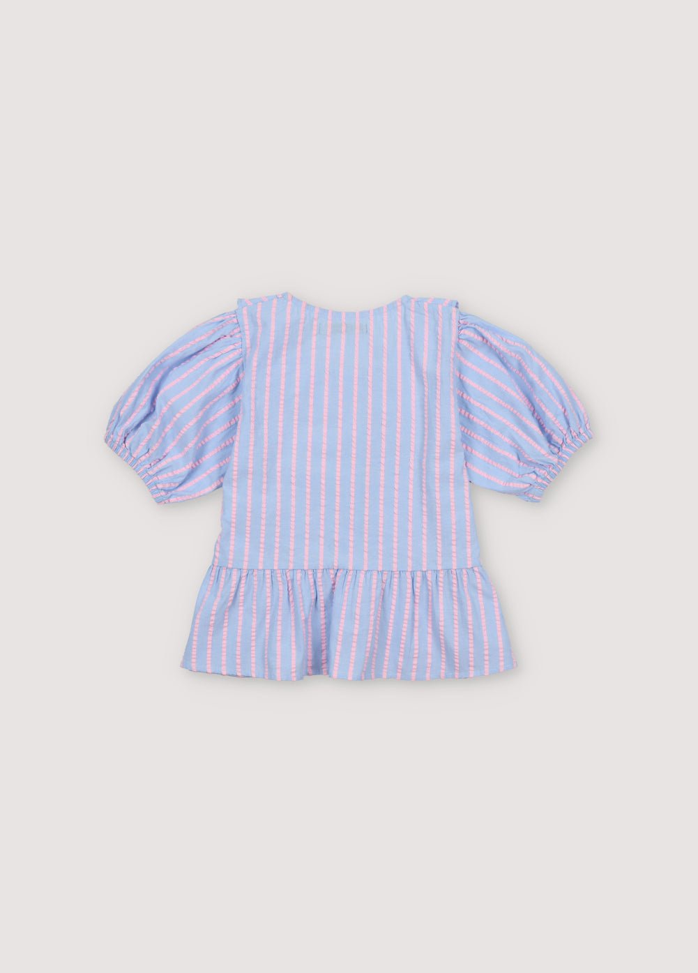 Kythira Blouse in 100% cotton striped fabric with cut details and ruffles at the hem, ruffled neckline, puffed short sleeves, and mother-of-pearl flower-shaped buttons.