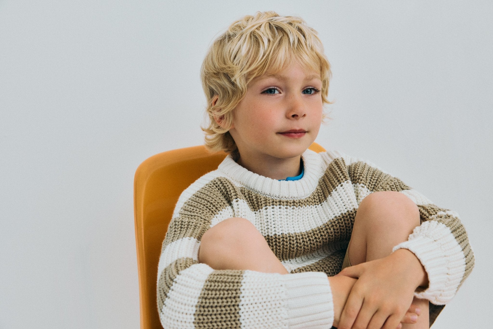 Classic rib knit sweater featuring&nbsp;two tone stripes and a branded embroidery on the ribbed hem.