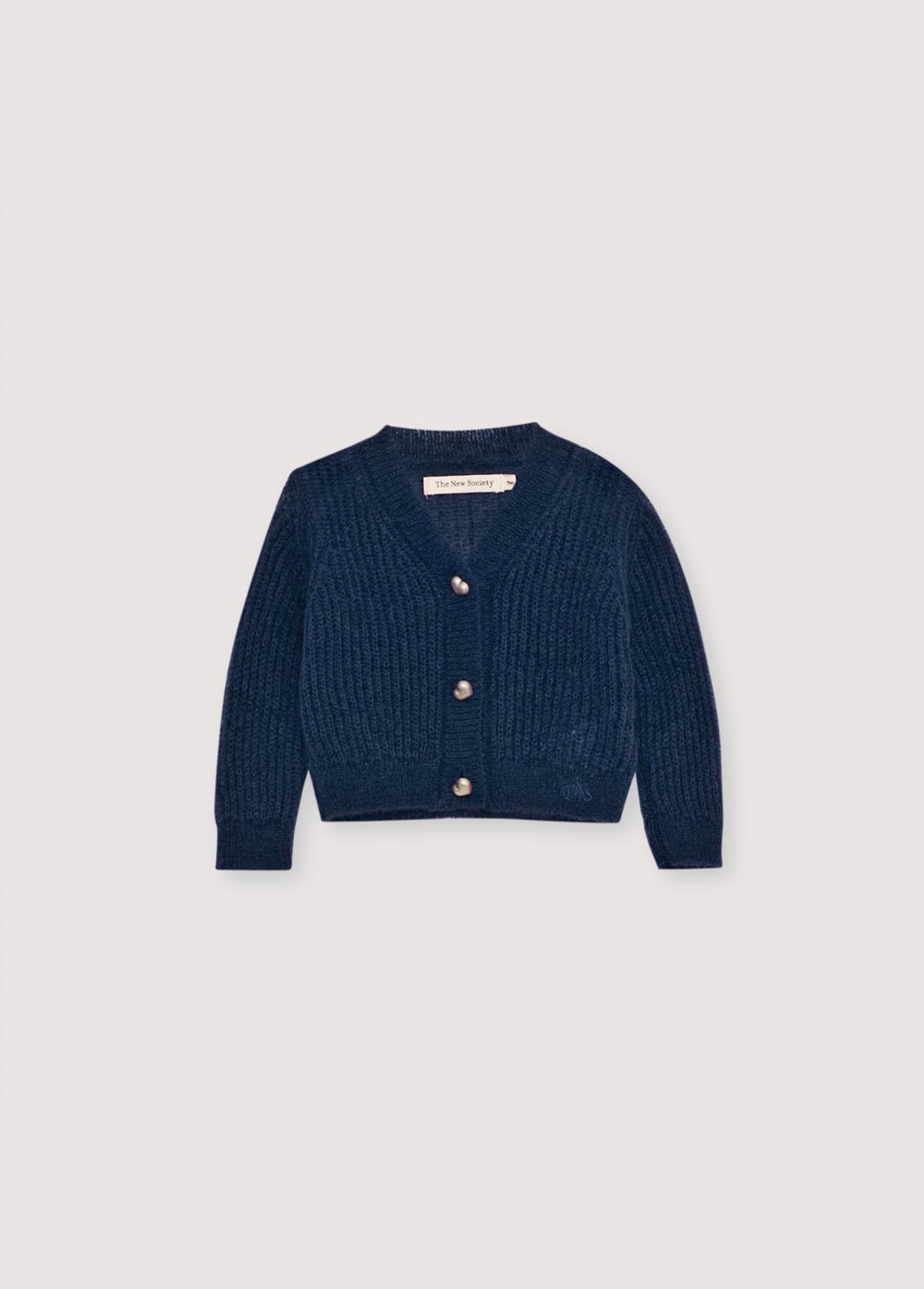 Cardigan en mohair en fine côte avec une encolure V et des boutons originaux en forme de cœur argentés. Il s'associe parfaitement avec des leggings en tricot assortis pour un look complet.
