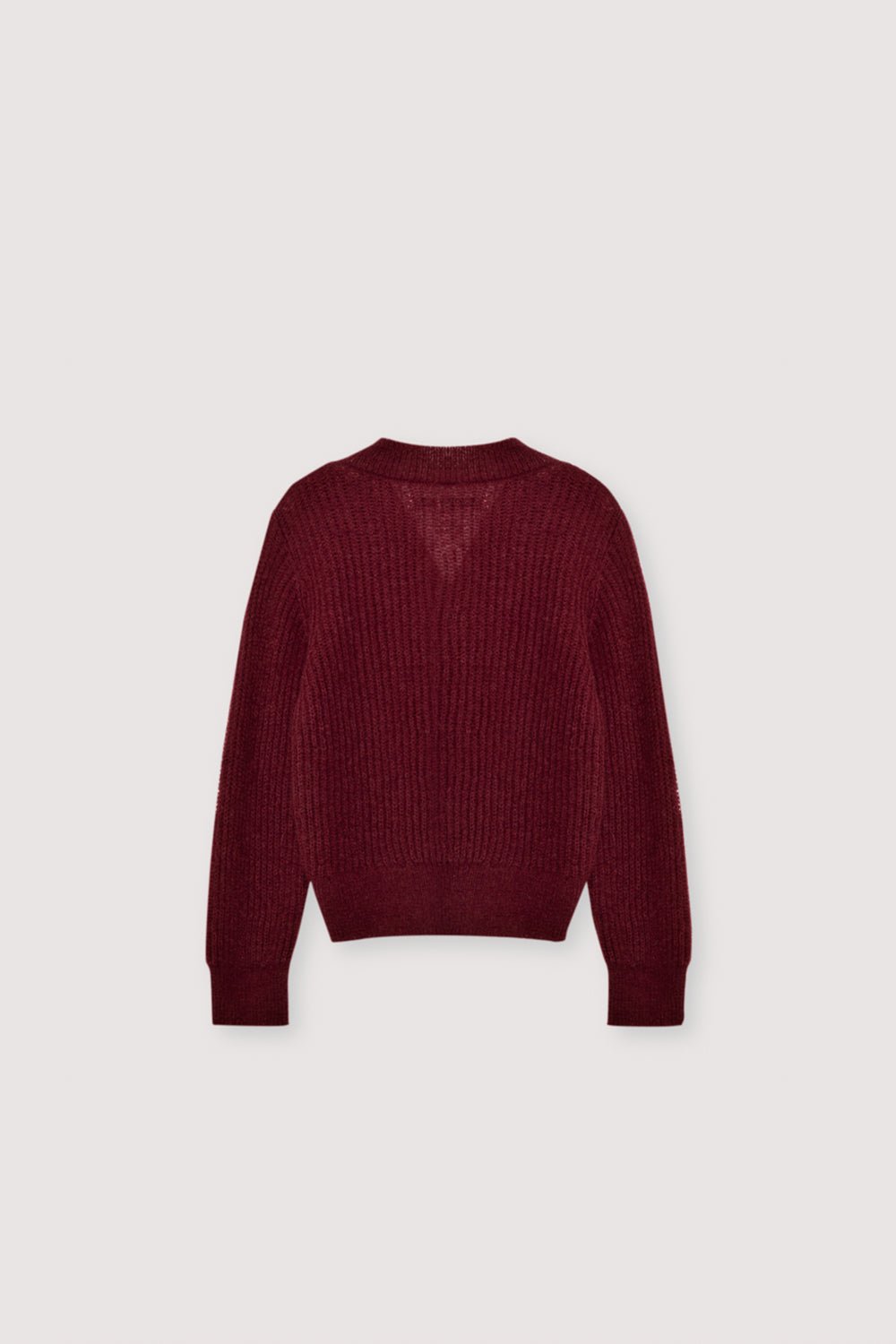 Cárdigan de mohair en punto fino de canalé con un favorecedor escote en pico y distintivos botones plateados en forma de corazón. Acabado con un bordado TNS tonal en el dobladillo del canalé, combina sin esfuerzo con los leggings de punto a juego para lograr un look acogedor pero refinado.