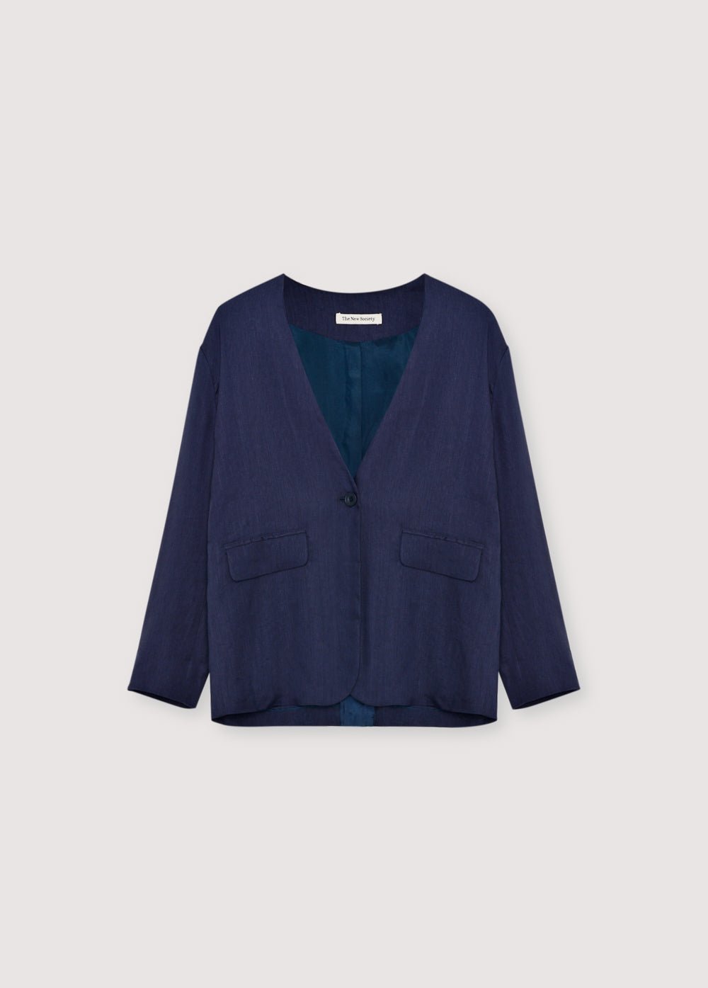 Linen and viscose blazer made in our workshops in Spain. Features a front opening with a notched collar, tone - on-tone button closure, and two front pockets.