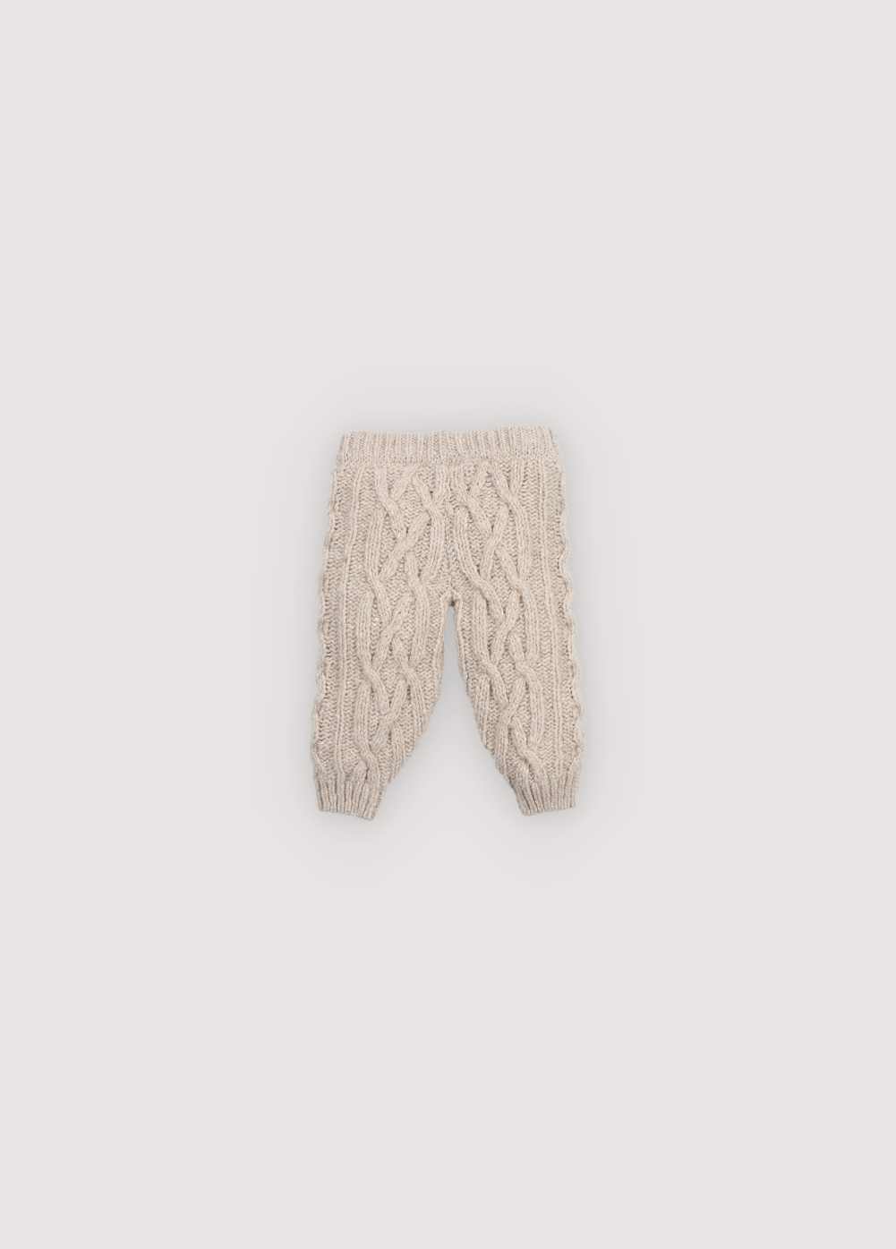 Knitted pants with a ribbed waistband and cuffs. Comes with a matching cardigan to complete the look. Made with high-quality recycled materials.