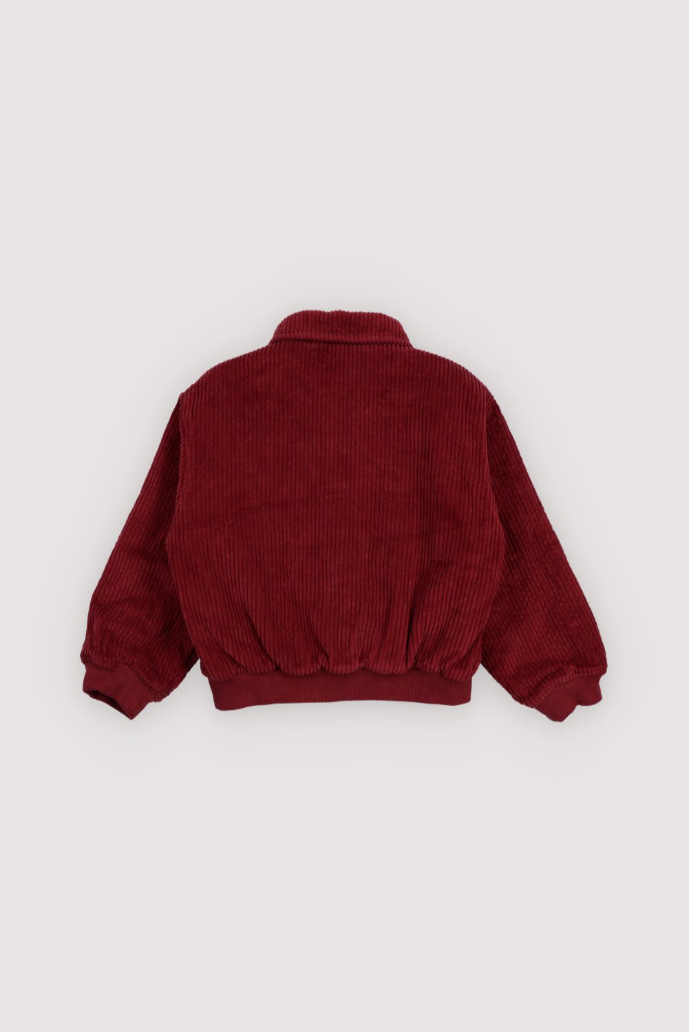 This corduroy bomber jacket in Plum Fantasy features ribbed cuffs and hem in a matching tone for a clean, cohesive look