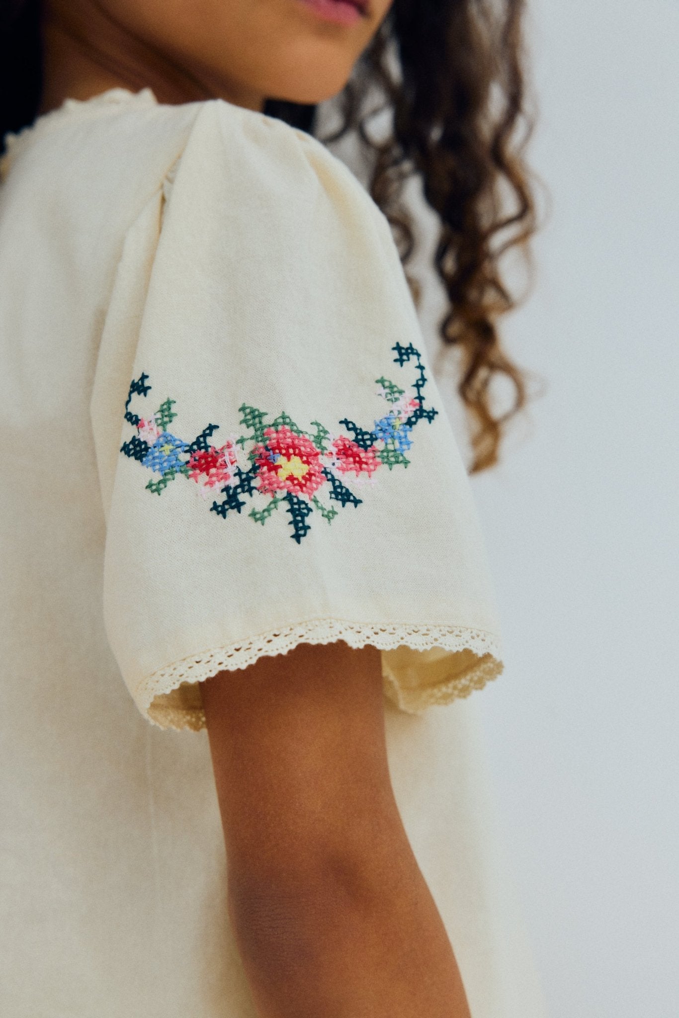 Blouse in soft cotton featuring beautiful fine embroidery details on the front and sleeves, adding a delicate and refined touch.