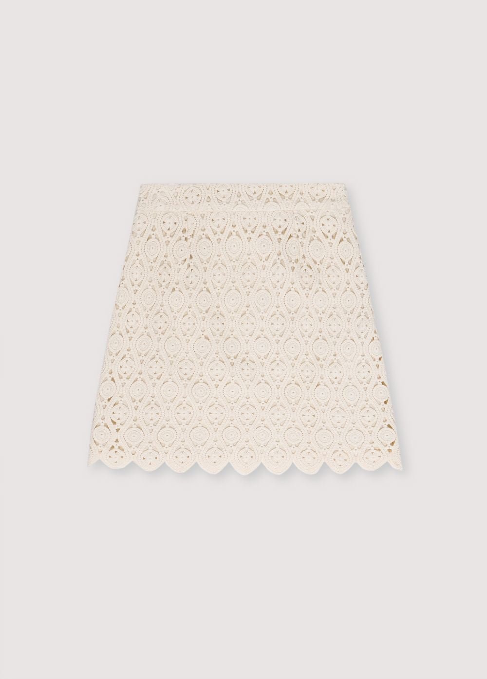 Jupe en crochet avec doublure intérieure et fente latérale avec fermeture éclair invisible. Parfait pour créer un look coordonné avec le haut assorti.