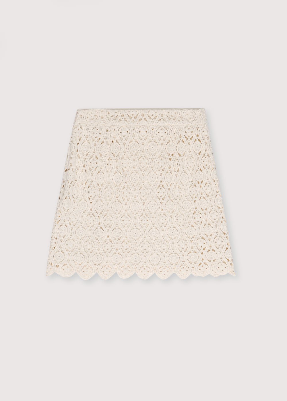 Jupe en crochet avec doublure intérieure et fente latérale avec fermeture éclair invisible. Parfait pour créer un look coordonné avec le haut assorti.