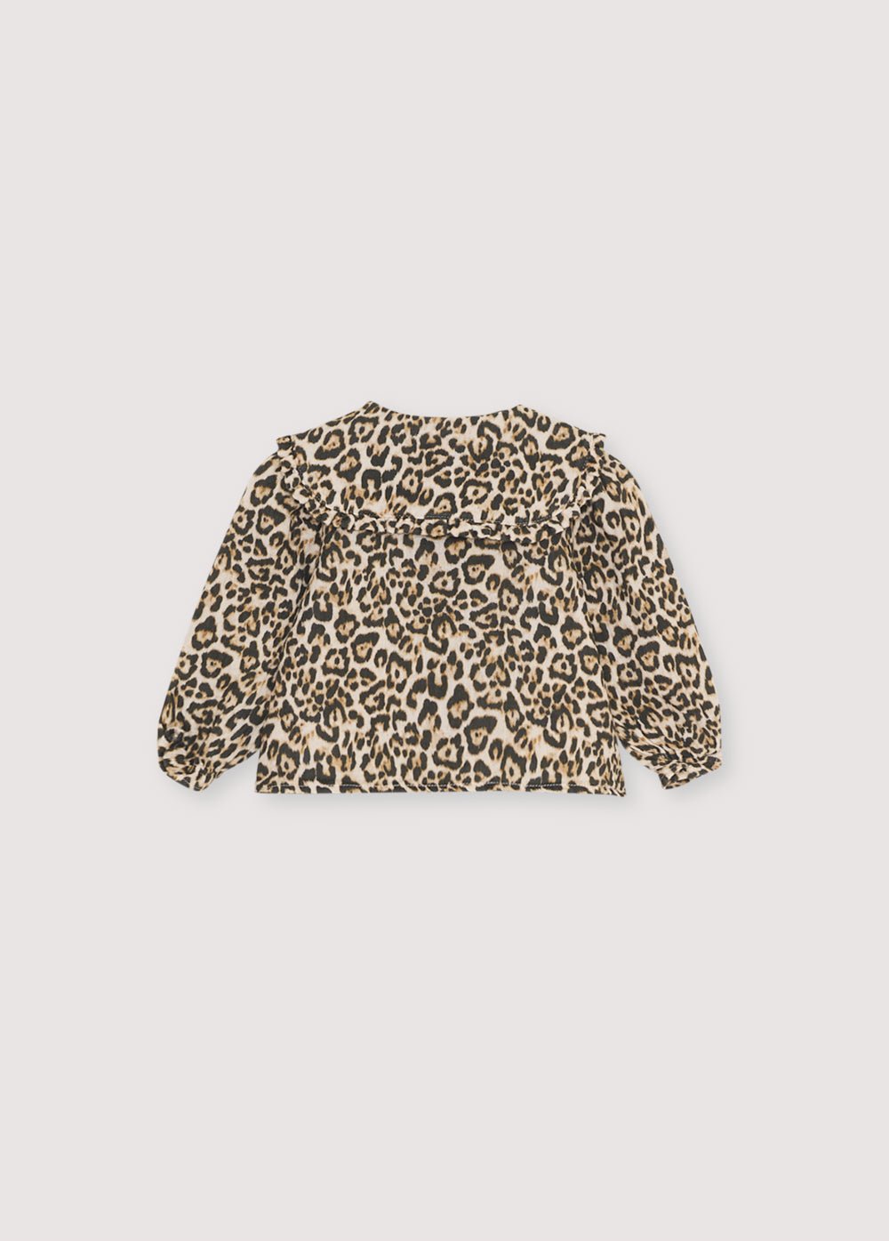 Baby blouse in double gauze with a leopard animal print, featuring a front opening with fabric-covered buttons and a collar detail. You can make the total look with the matching pants