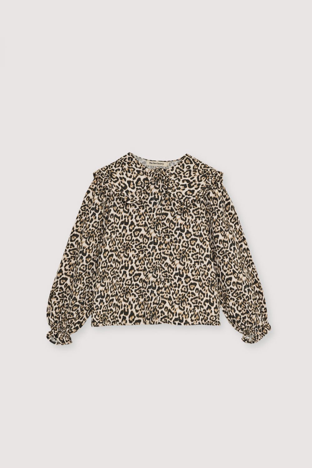 This blouse in soft double gauze fabric features a striking leopard animal print, adding a trendy touch to a classic design. Nelia Blouse . The New Society kids collection