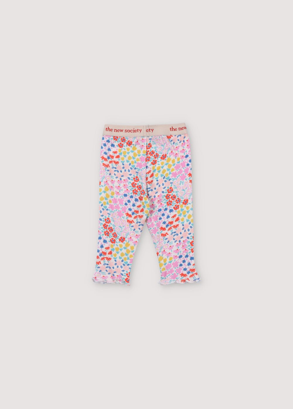 Legging côtelé à imprimé floral multicolore. Il présente une taille élastique avec logo contrasté et des poignets ornés d'un surjet bébé. Il est livré avec un tee-shirt assorti. Collection Printemps Été. The New Society. 