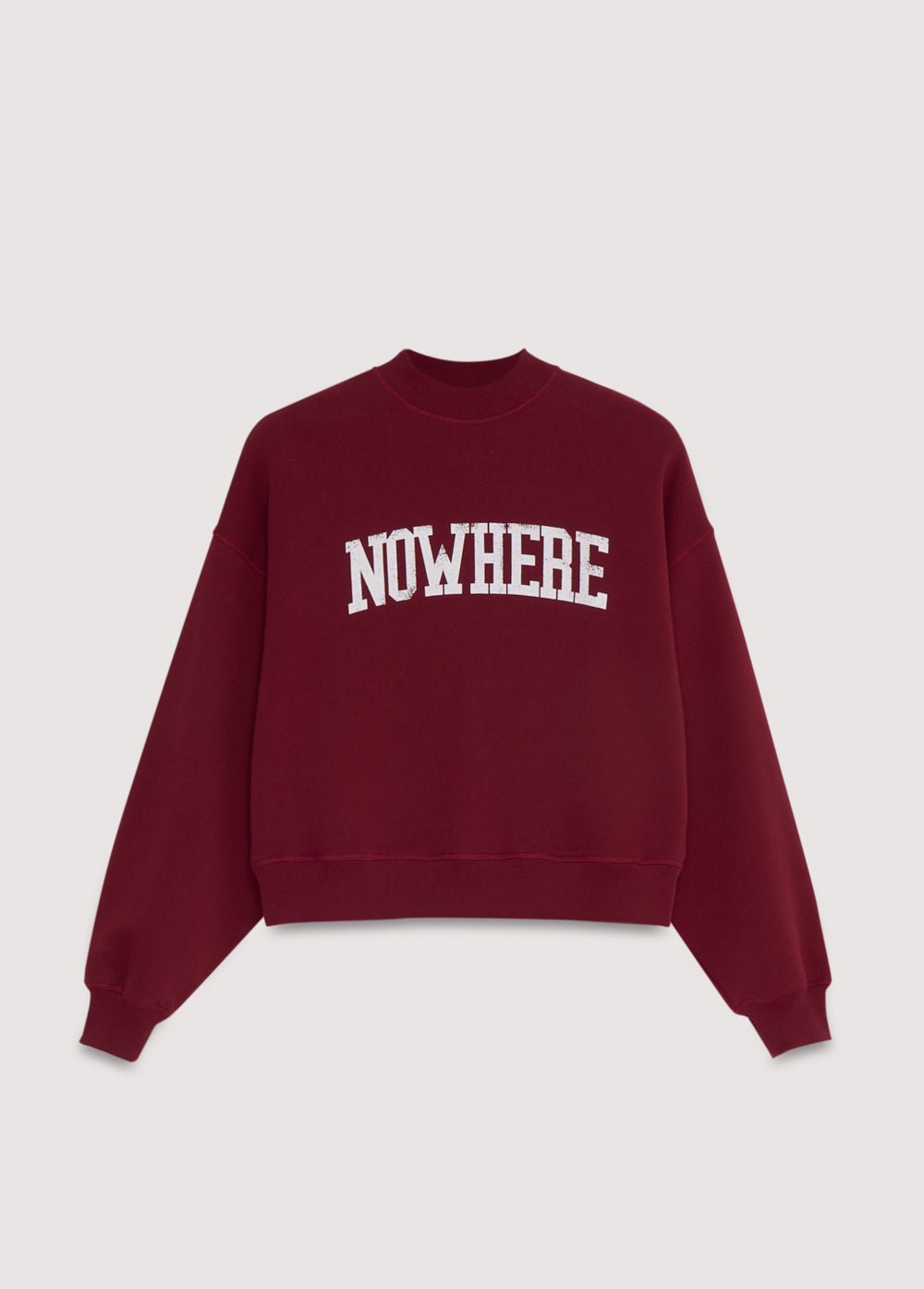 Crop-style sweatshirt with a ribbed high neck and a NOWHERE print detail on the front. Brushed on the inside and outside.