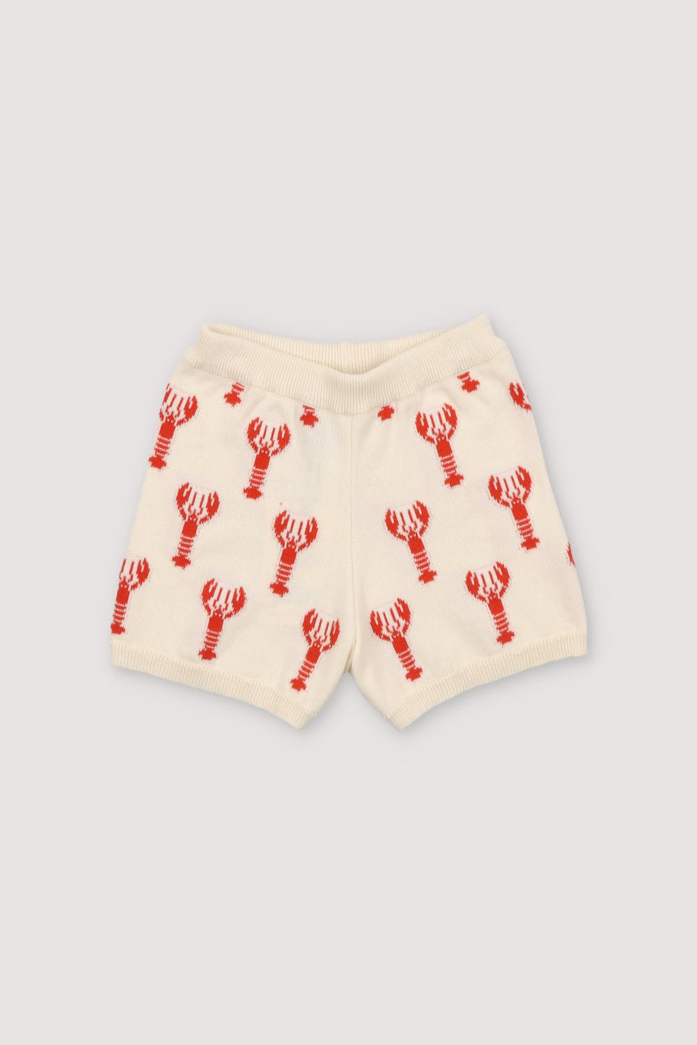 Knit shorts with a playful lobster intarsia pattern and ribbed elastic waistband. It has a matching top to create a perfect summer look. Spring Smmer Collection. The New Society. 