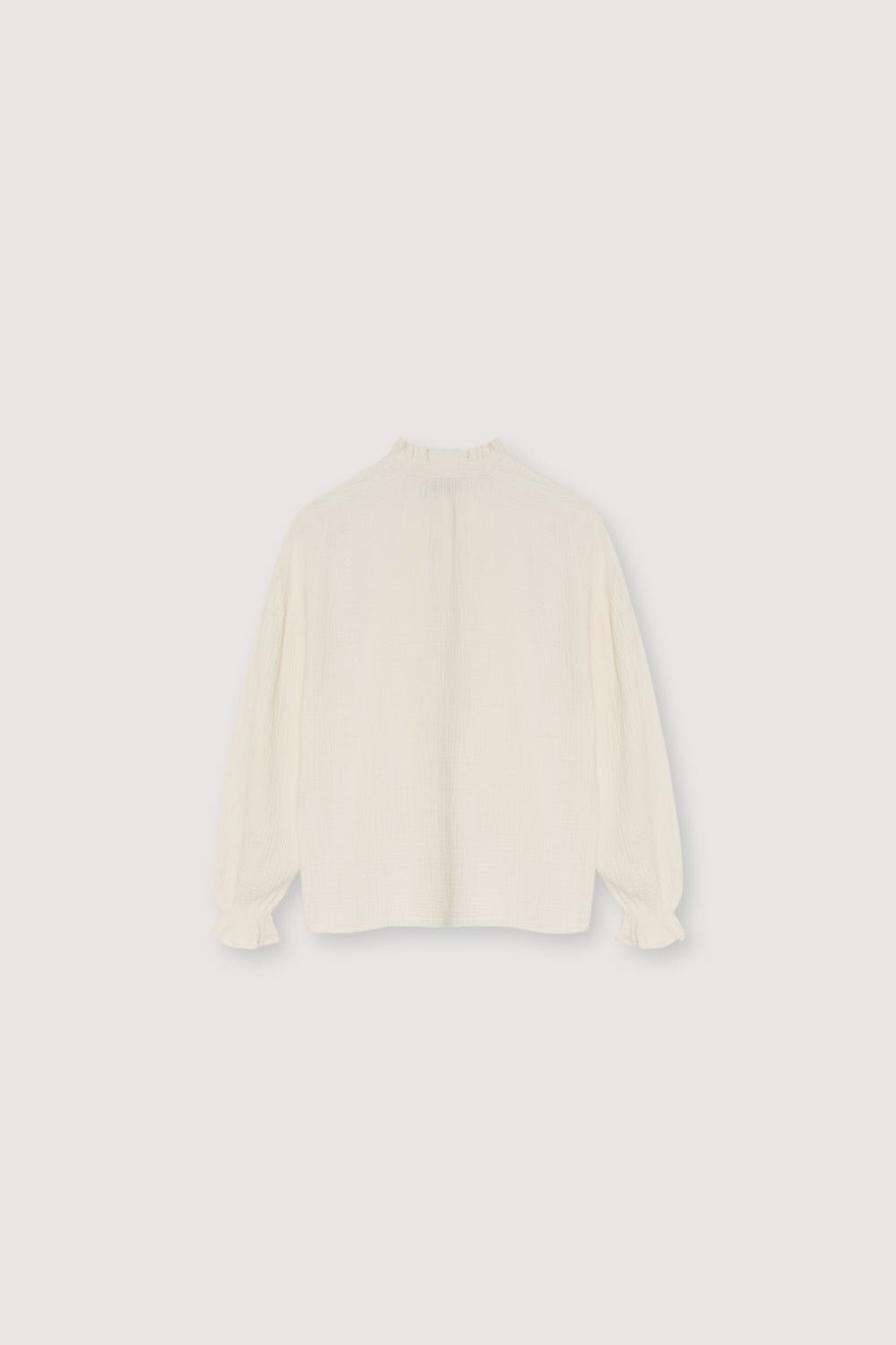 Our classic Olivia Blouse, made from double gauze fabric. It features puffed sleeves and a front keyhole detail with a tie.