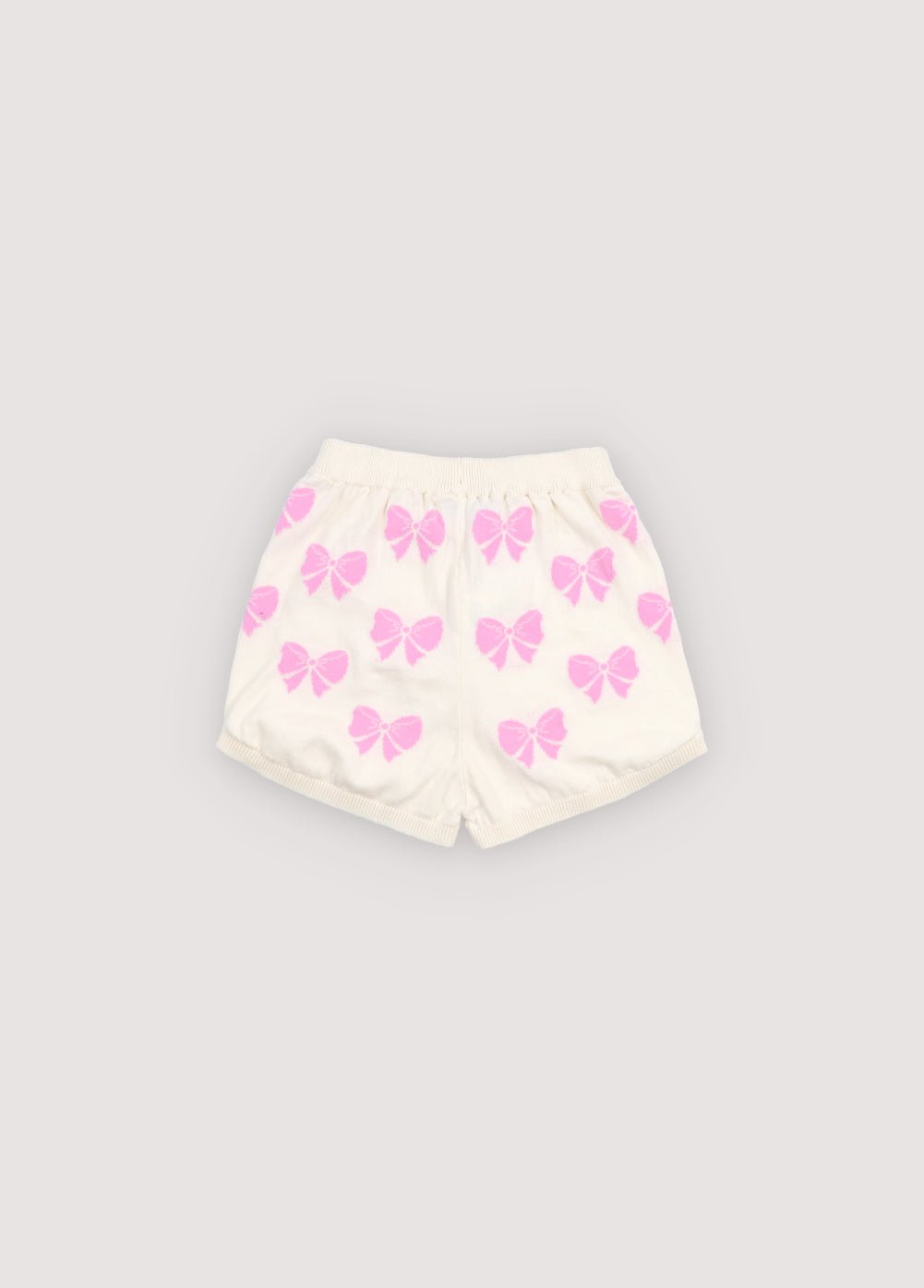 Fine 100% cotton knit shorts featuring delicate pink bows. Designed with an elastic ribbed waistband and ribbed hems for a comfortable fit.