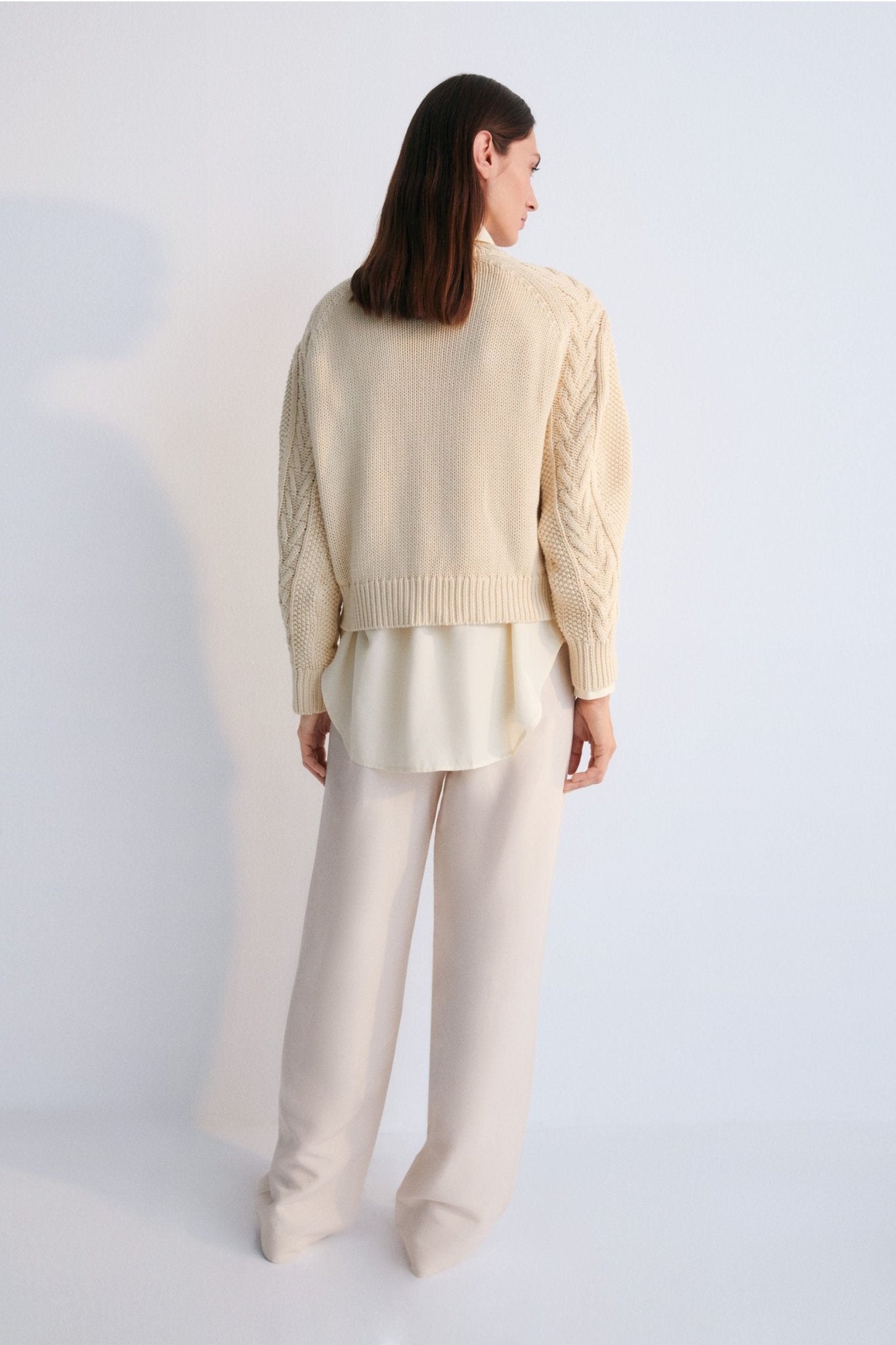 One of our best-selling sweaters. Knitted with an original structure and featuring a pleat detail on the sleeve. Sprin Summer Collection. The New Society.