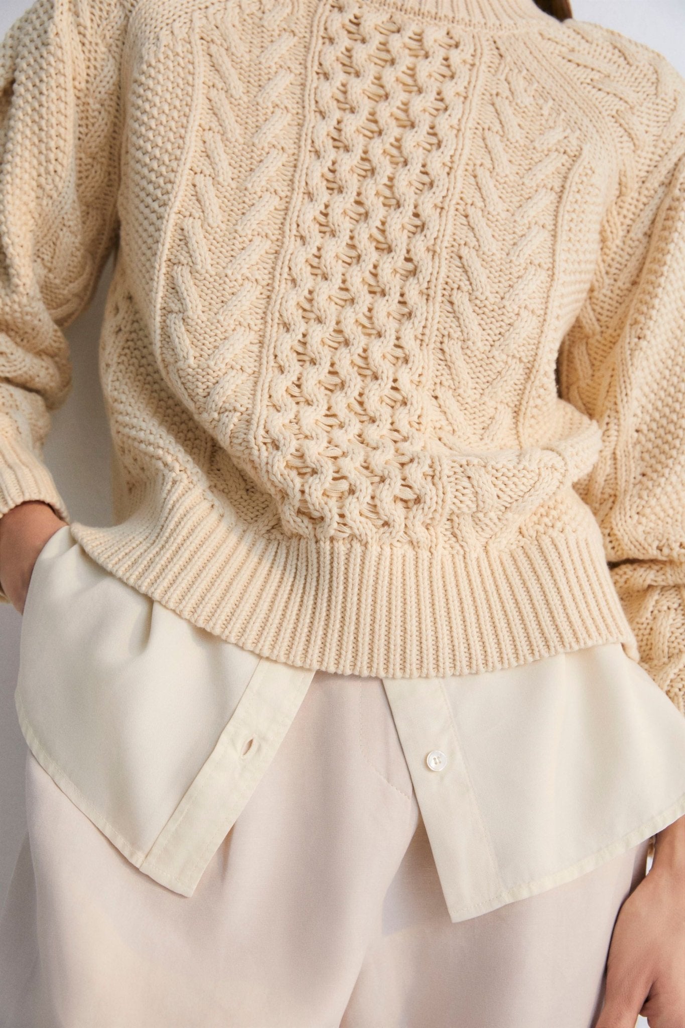 One of our best-selling sweaters. Knitted with an original structure and featuring a pleat detail on the sleeve. Sprin Summer Collection. The New Society.